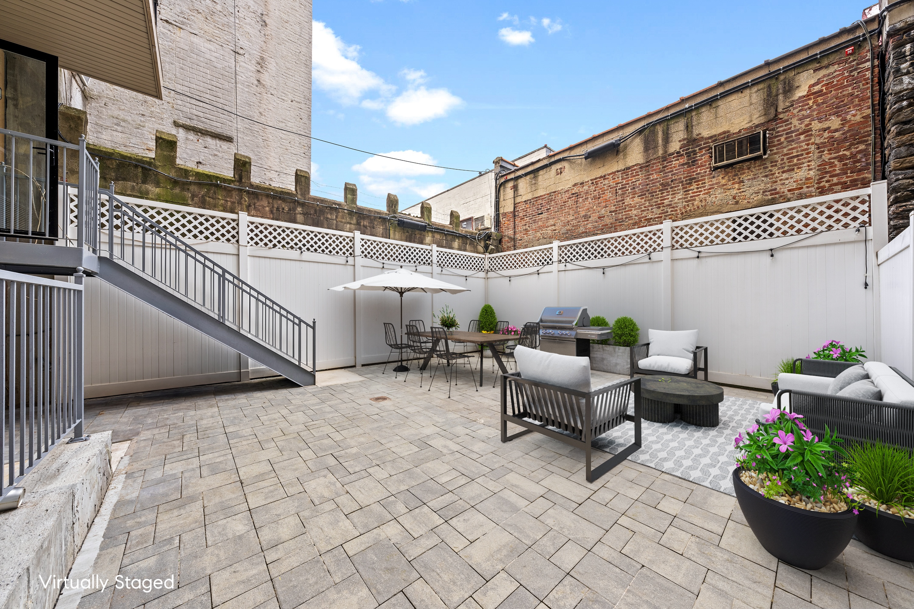 399 East 8th Street, Unit 1A Manhattan, NY 10009 - Photo 9 of 13 a view of a patio with couches and potted plants