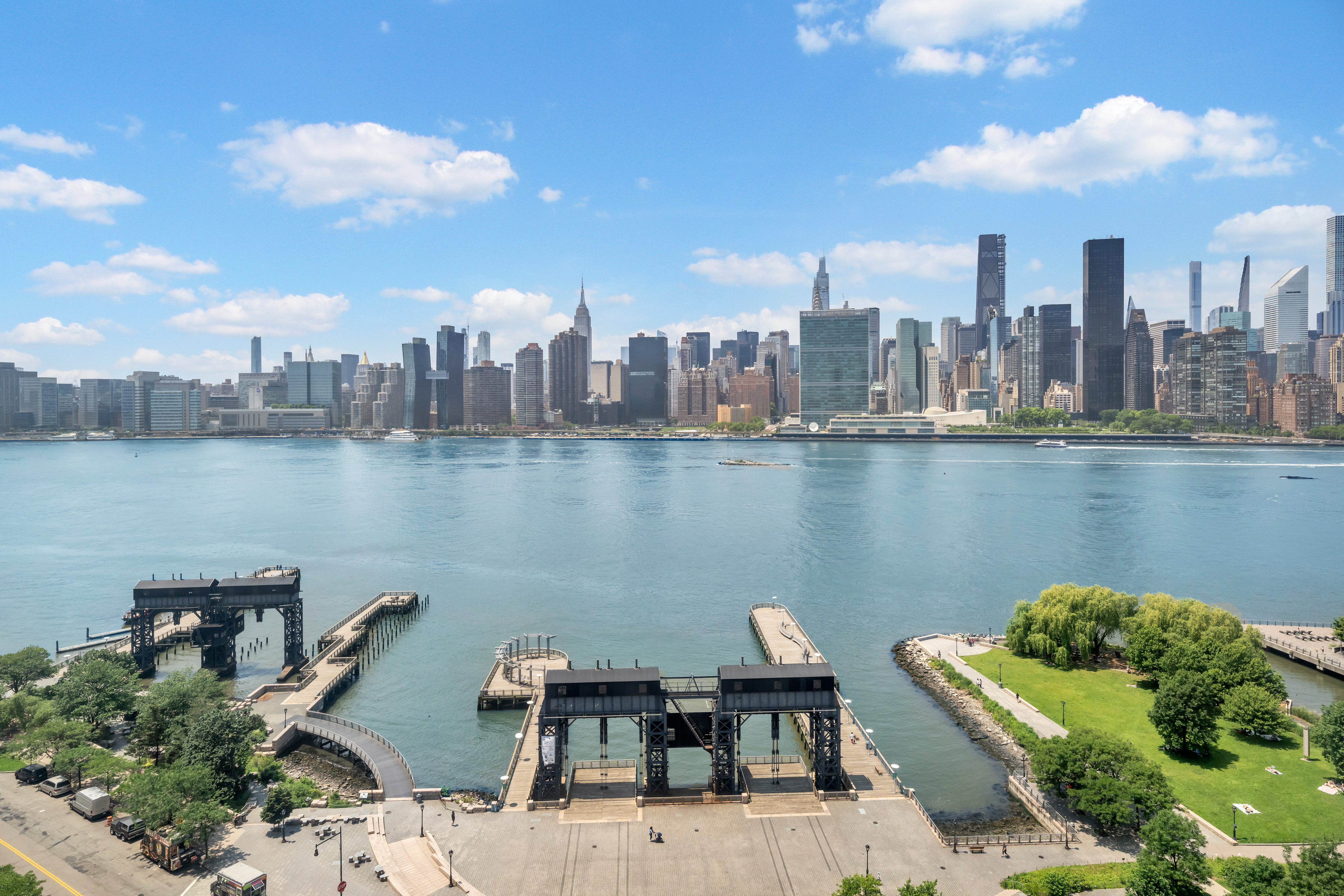 4-74 48th Avenue, Unit 19B Queens, NY 11109 - Photo 2 of 10 a terrace with a table and chairs