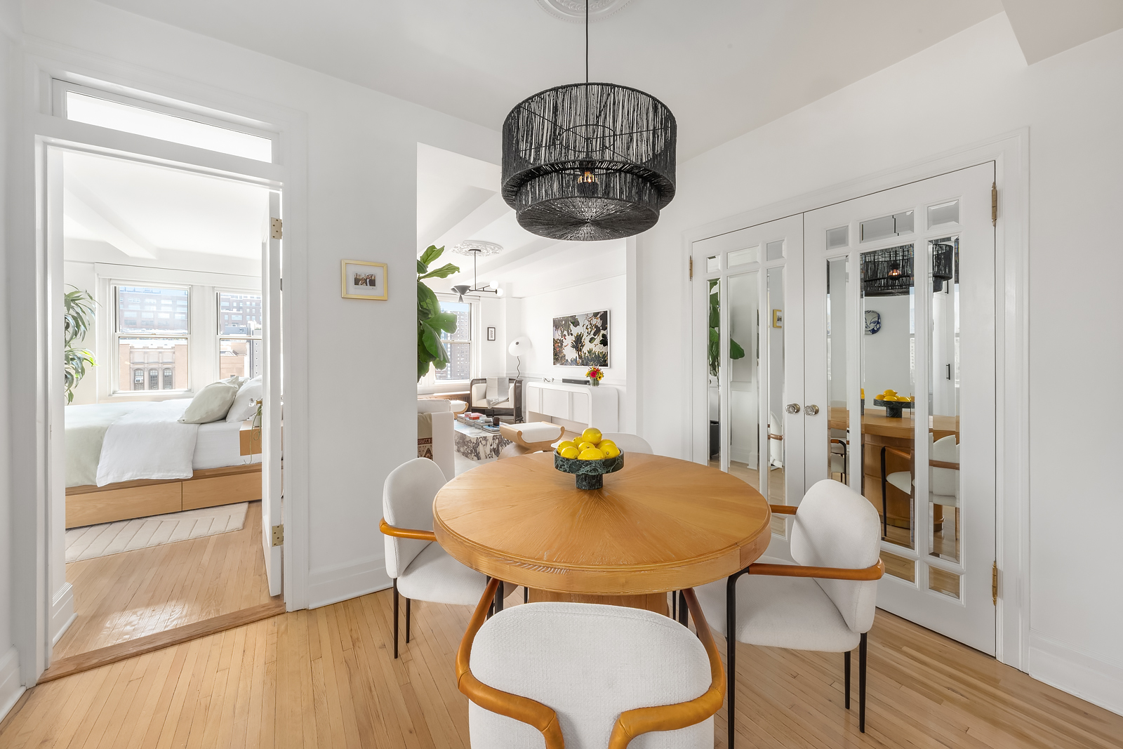 365 West 20th Street, Unit 14B Manhattan, NY 10011 - Photo 5 of 21 a view of a dining room with furniture window and wooden floor