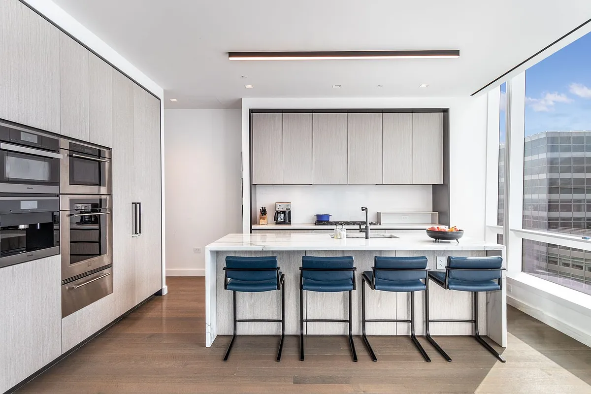 111 Murray Street, Unit 61W Manhattan, NY 10007 - Photo 9 of 35 a view of a kitchen with a sink and cabinets