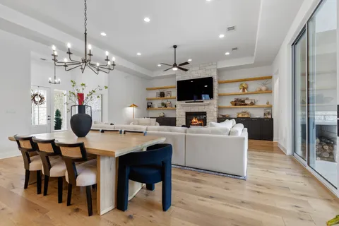 a living room with kitchen island furniture and a flat screen tv
