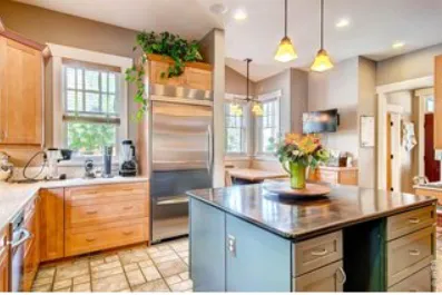 a kitchen with granite countertop a sink cabinets and window