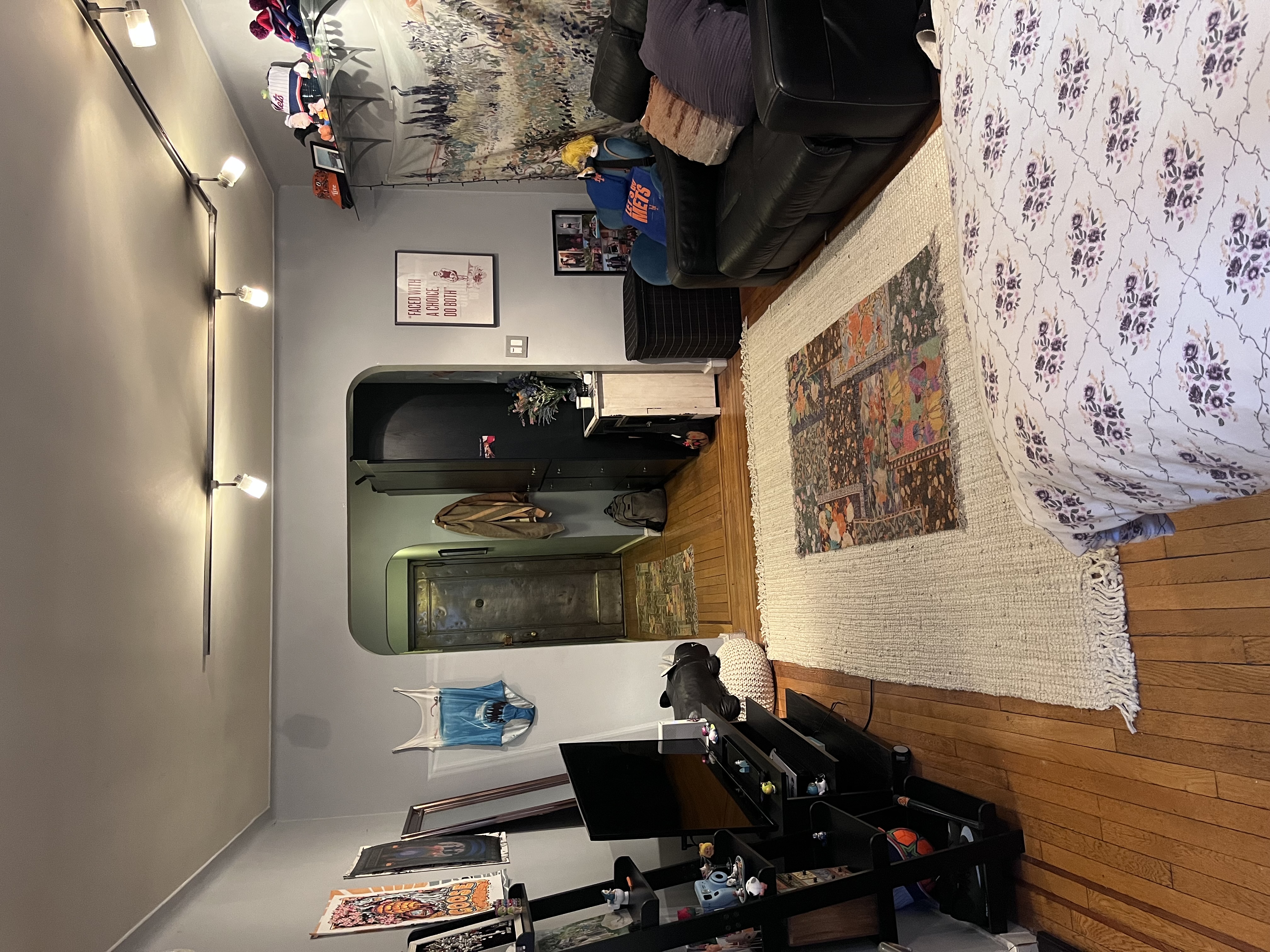 166 West 22nd Street, Unit 1F Manhattan, NY 10011 - Photo 6 of 7 a living room with furniture and a flat screen tv