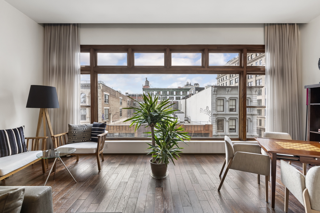 405 Broadway, Unit PH Manhattan, NY 10013 - Photo 3 of 17 a living room with furniture and wooden floor