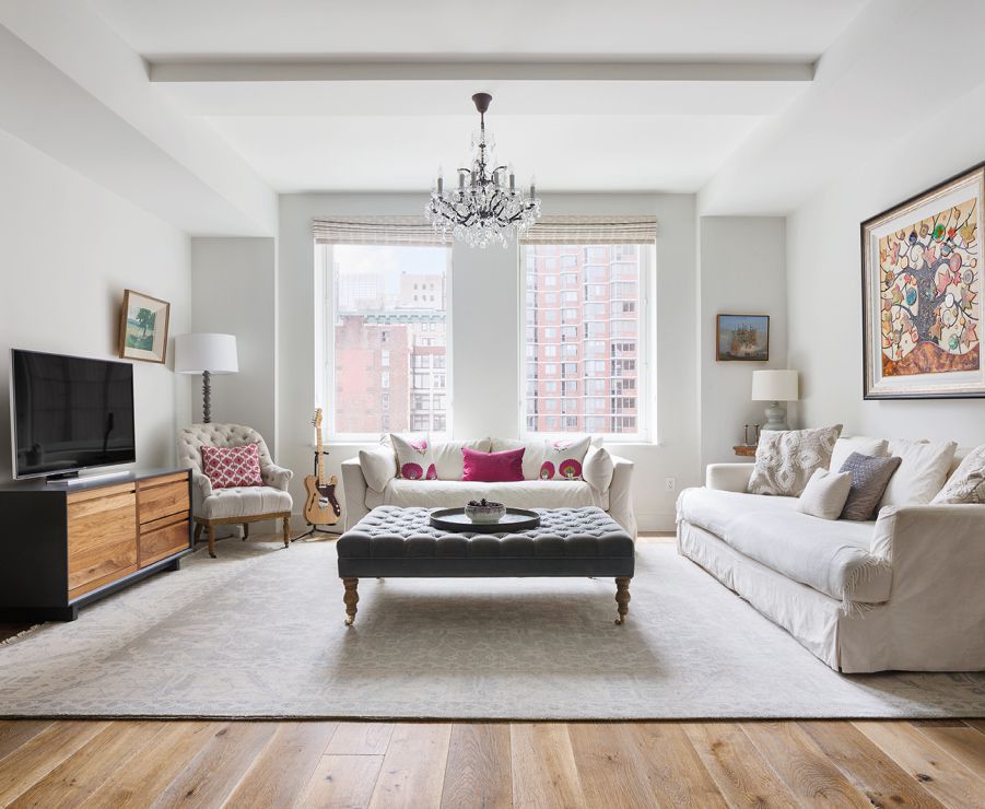 a living room with furniture and a flat screen tv
