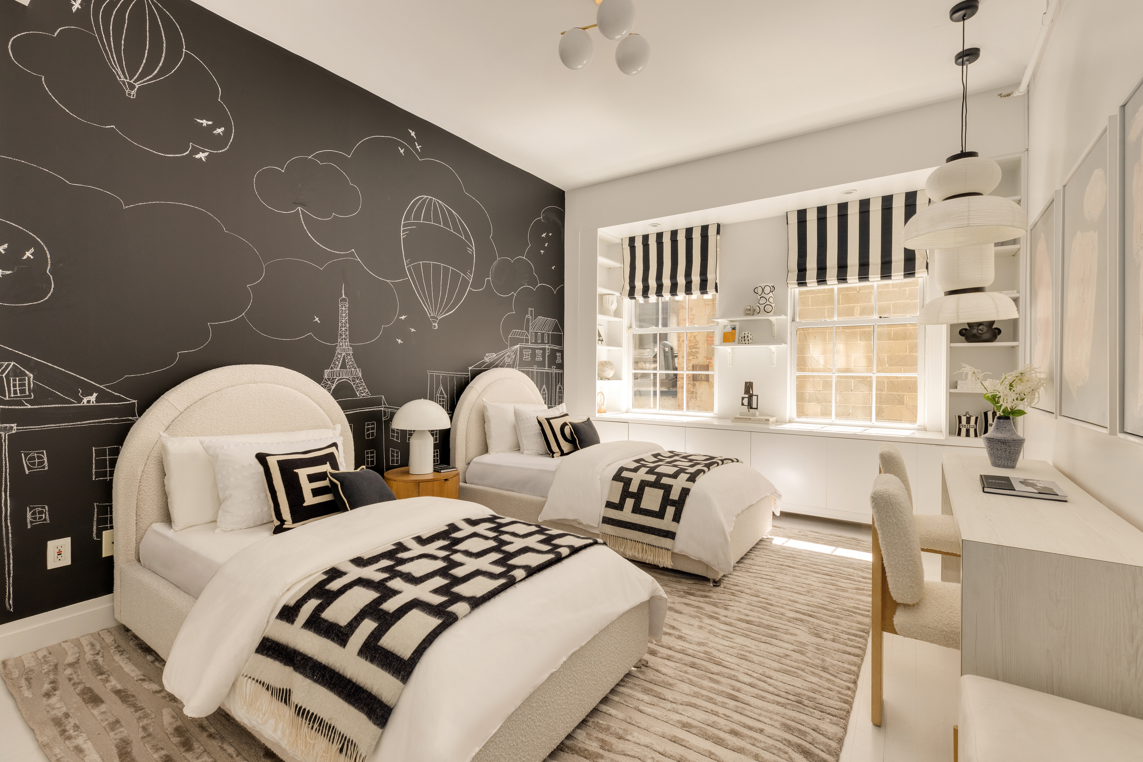 18 Leonard Street, Unit 2D Manhattan, NY 10013 - Photo 16 of 22 a bedroom with a bed a couch and a window