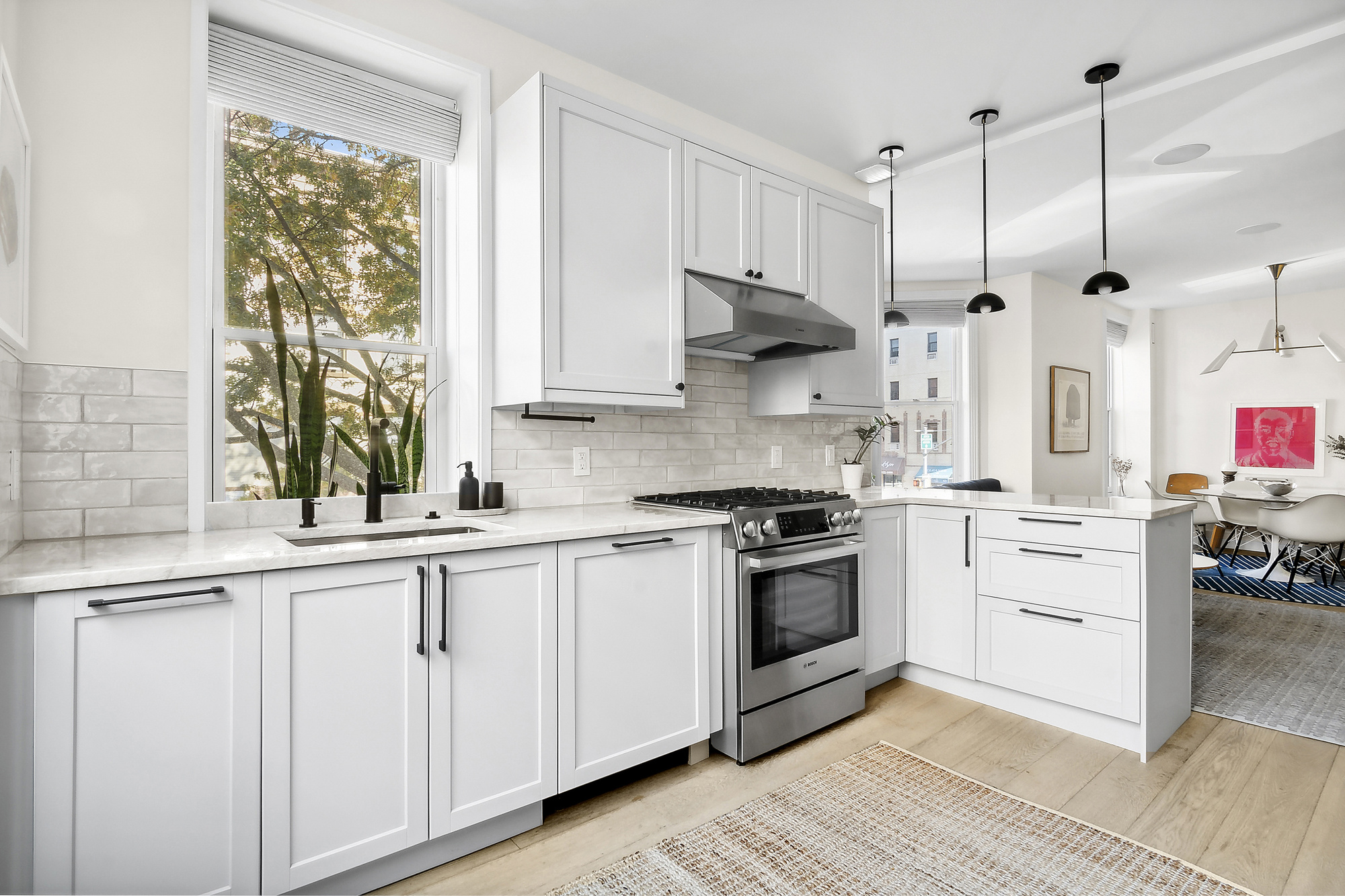 374 14th Street Brooklyn, NY 11215 - Photo 3 of 11 a kitchen with white cabinets and white appliances