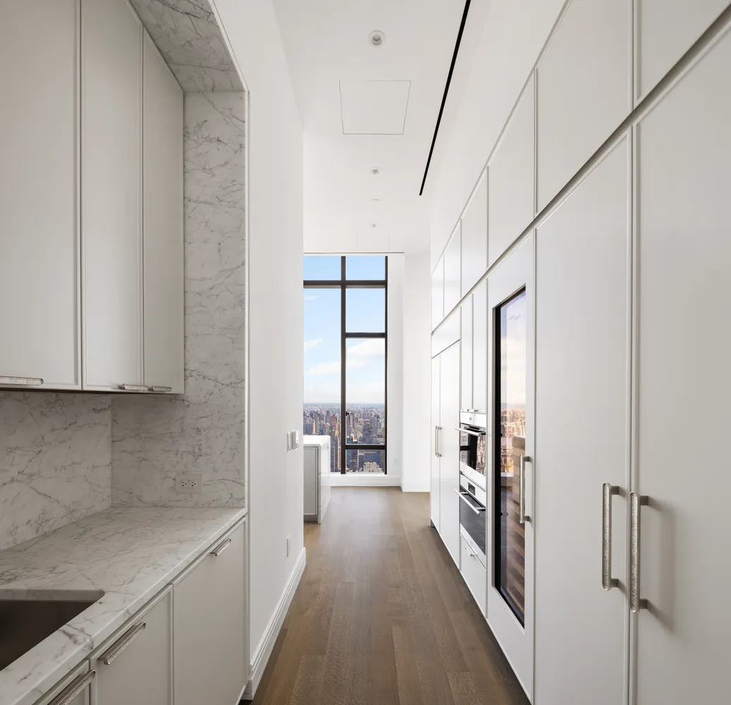 a bedroom with a large window and a bed