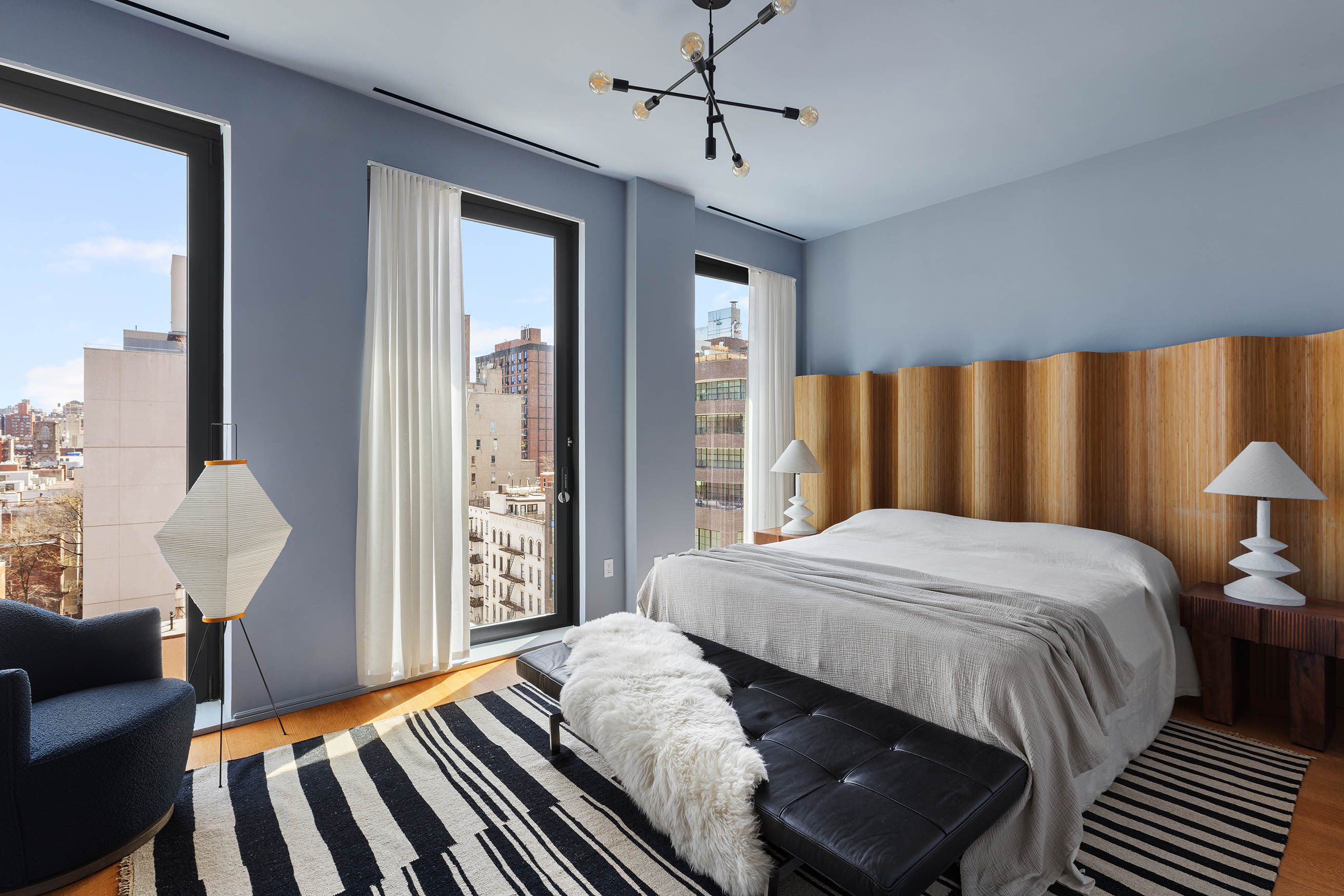 505 West 19th Street, Unit PH1 Manhattan, NY 10011 - Photo 20 of 26 a bedroom with a large bed couch and a window