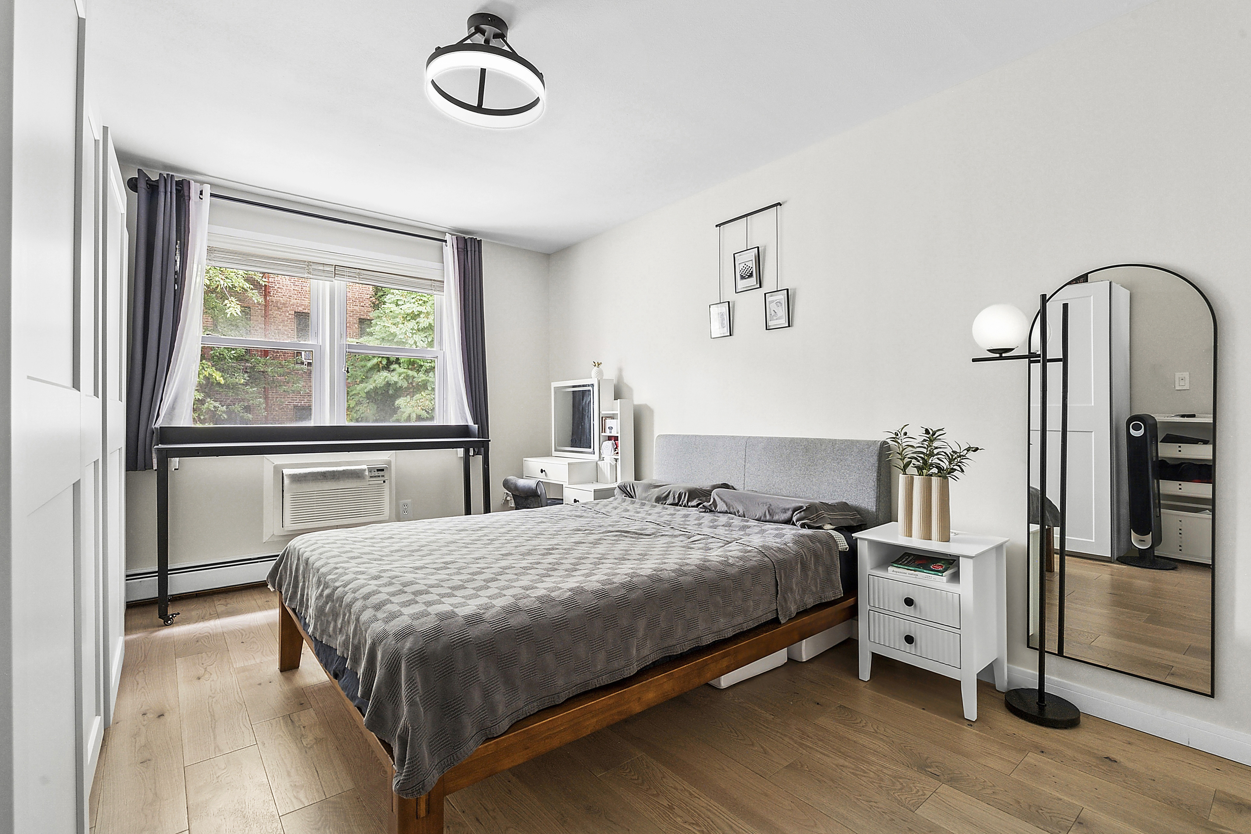 143 Bay Ridge Parkway, Unit 3 Brooklyn, NY 11209 - Photo 5 of 12 a bedroom with a bed and a window