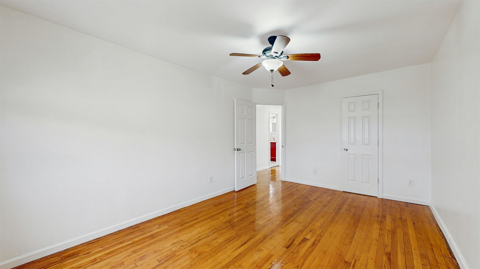 295 Conklin Avenue, Unit 3 Brooklyn, NY 11236 - Photo 9 of 15 a view of empty room with wooden floor