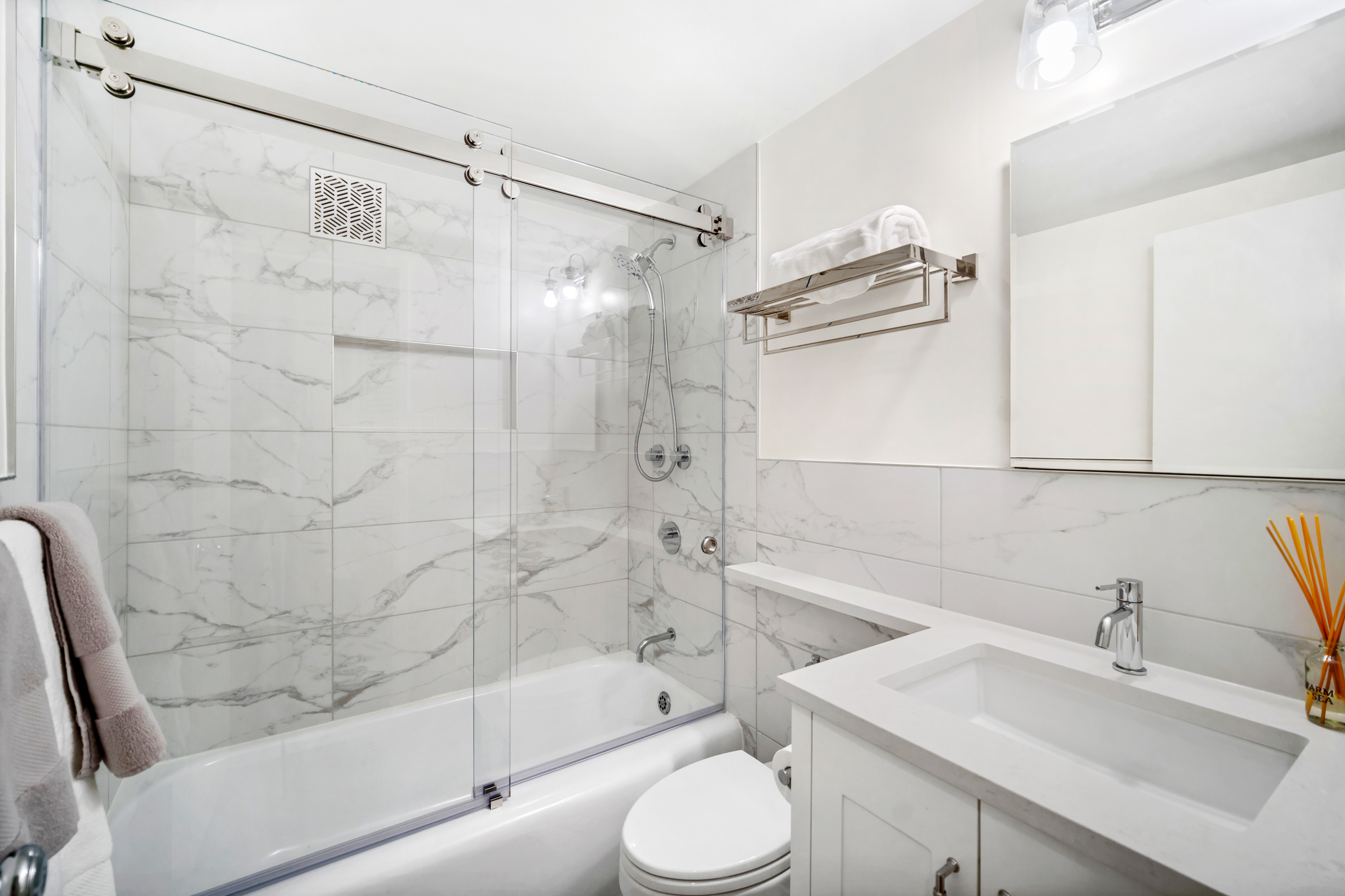 2 5th Avenue, Unit 2R Manhattan, NY 10011 - Photo 8 of 12 a bathroom with a sink toilet and shower