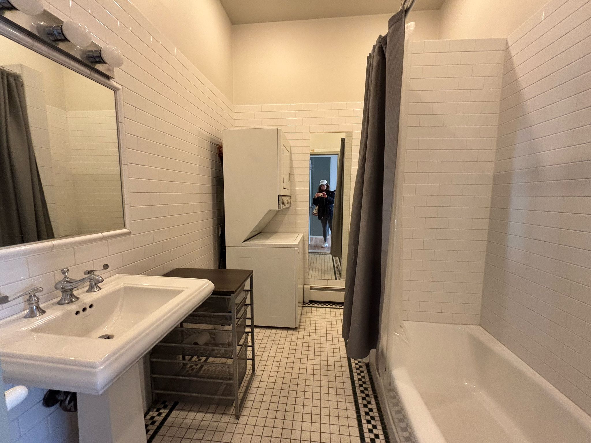 85 Division Street, Unit 4 Manhattan, NY 10002 - Photo 20 of 22 a bathroom with a sink and a mirror