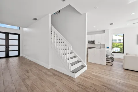 a kitchen with cabinets and stainless steel appliances