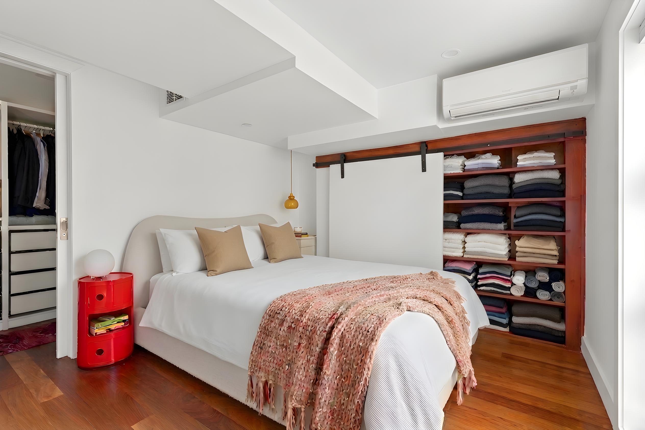 335 Warren Street, Unit 401 Brooklyn, NY 11201 - Photo 8 of 15 a bedroom with a bed and a window