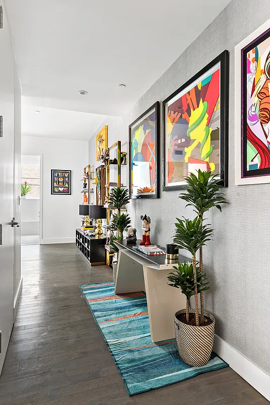 416 West 52nd Street, Unit 523 Manhattan, NY 10019 - Photo 2 of 16 a living room with furniture potted plant and open kitchen view