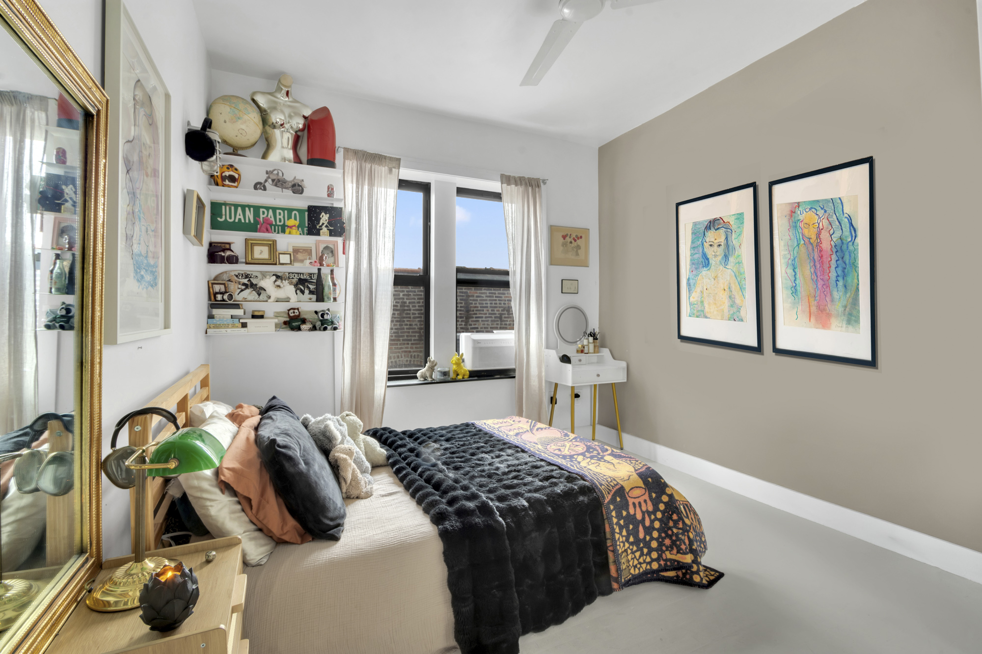 47 Fort Washington Avenue, Unit 61 Manhattan, NY 10032 - Photo 12 of 14 a bedroom with bed and a potted plant