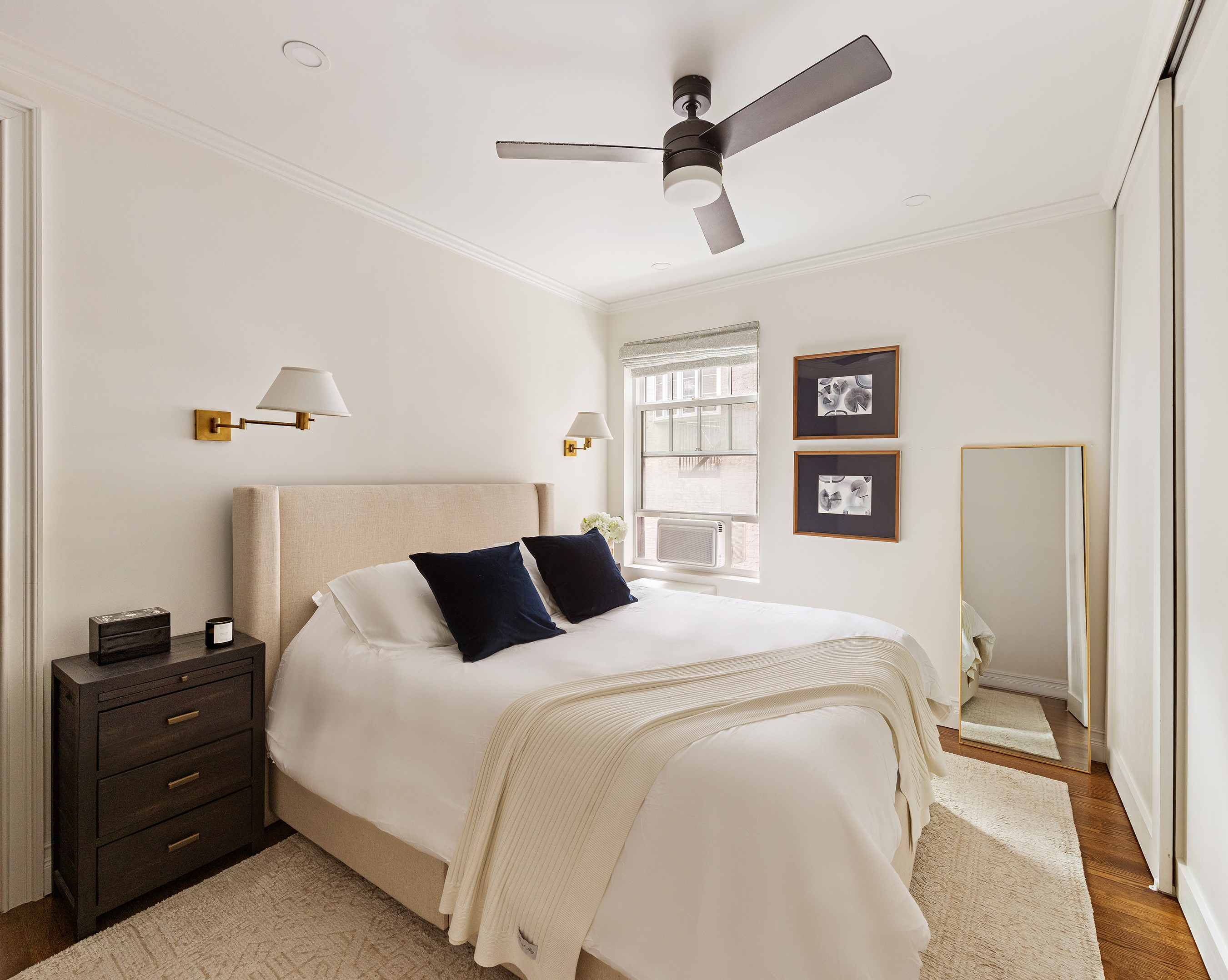15 West 11th Street, Unit 3C Manhattan, NY 10011 - Photo 6 of 10 a bedroom with a bed and wooden floor