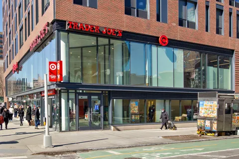 a view of street with shops on a street