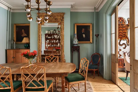 a view of a dining room with furniture and chandelier
