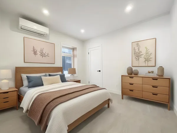 a view of a bedroom with bed and window