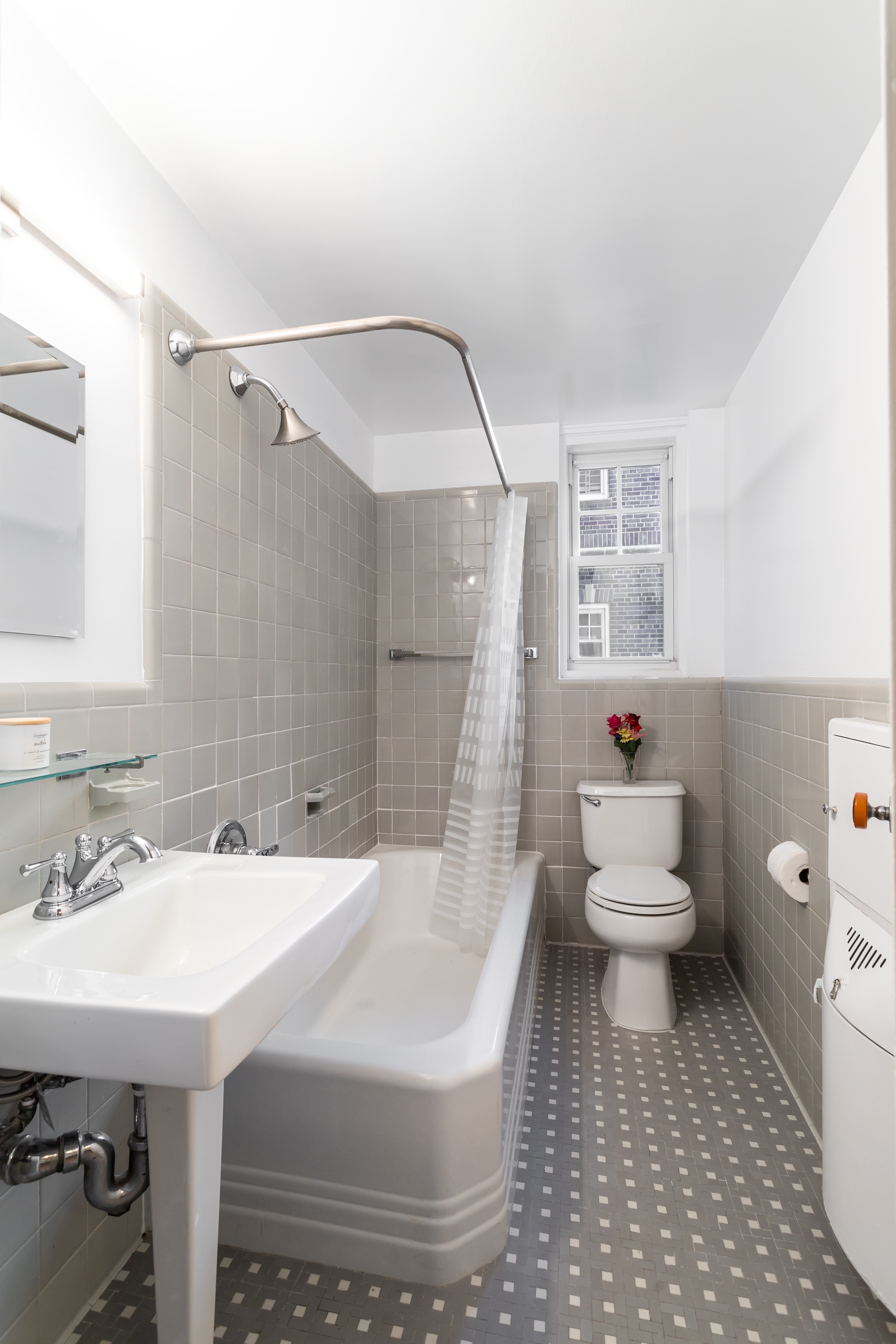 180 Cabrini Boulevard, Unit 37 Manhattan, NY 10033 - Photo 20 of 35 a bathroom with a sink toilet and shower