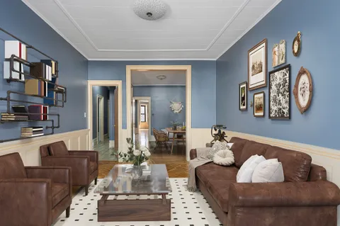 a living room with furniture and a rug