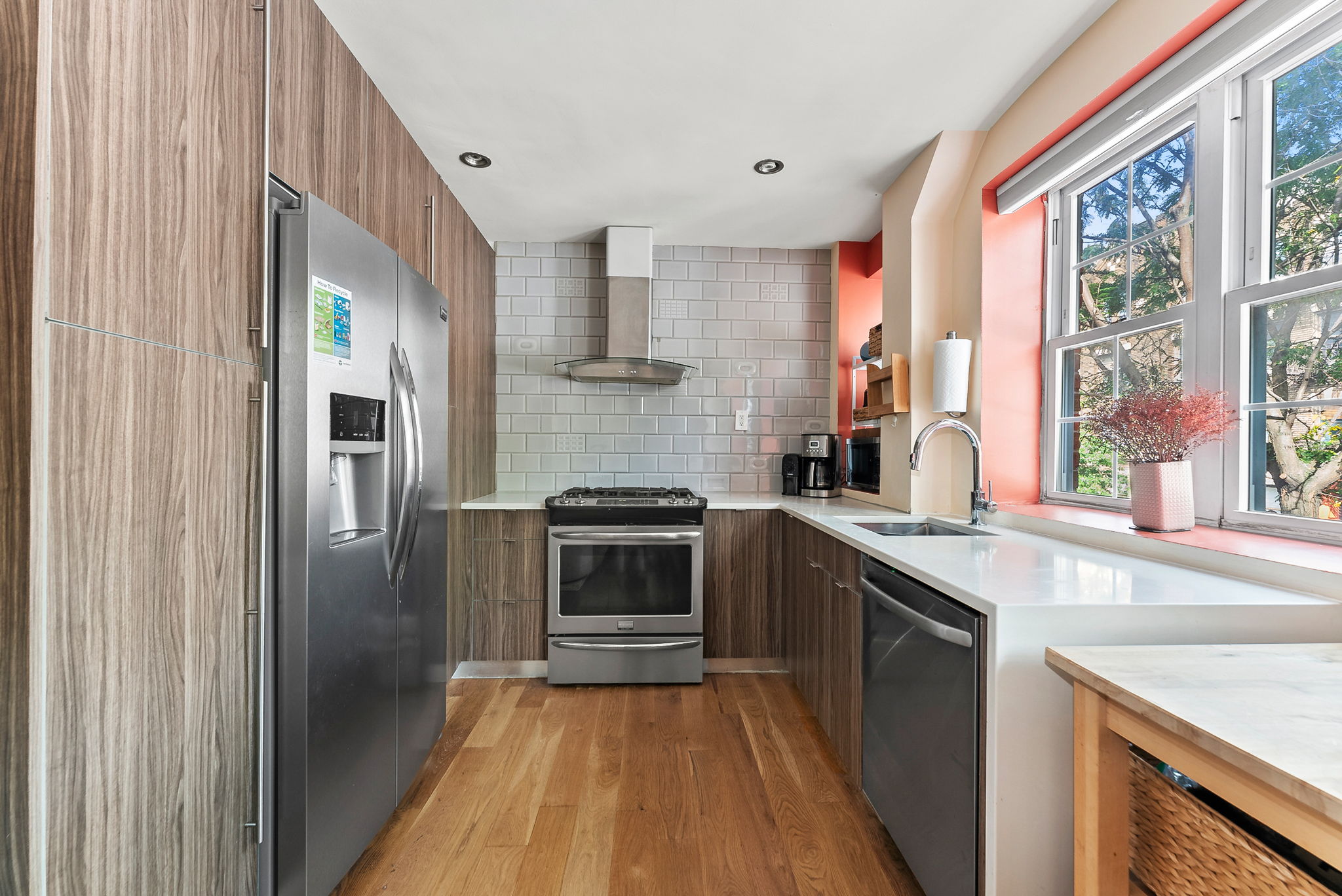 600 Prospect Place, Unit 2 Brooklyn, NY 11238 - Photo 4 of 13 a kitchen with stainless steel appliances granite countertop a refrigerator and a sink