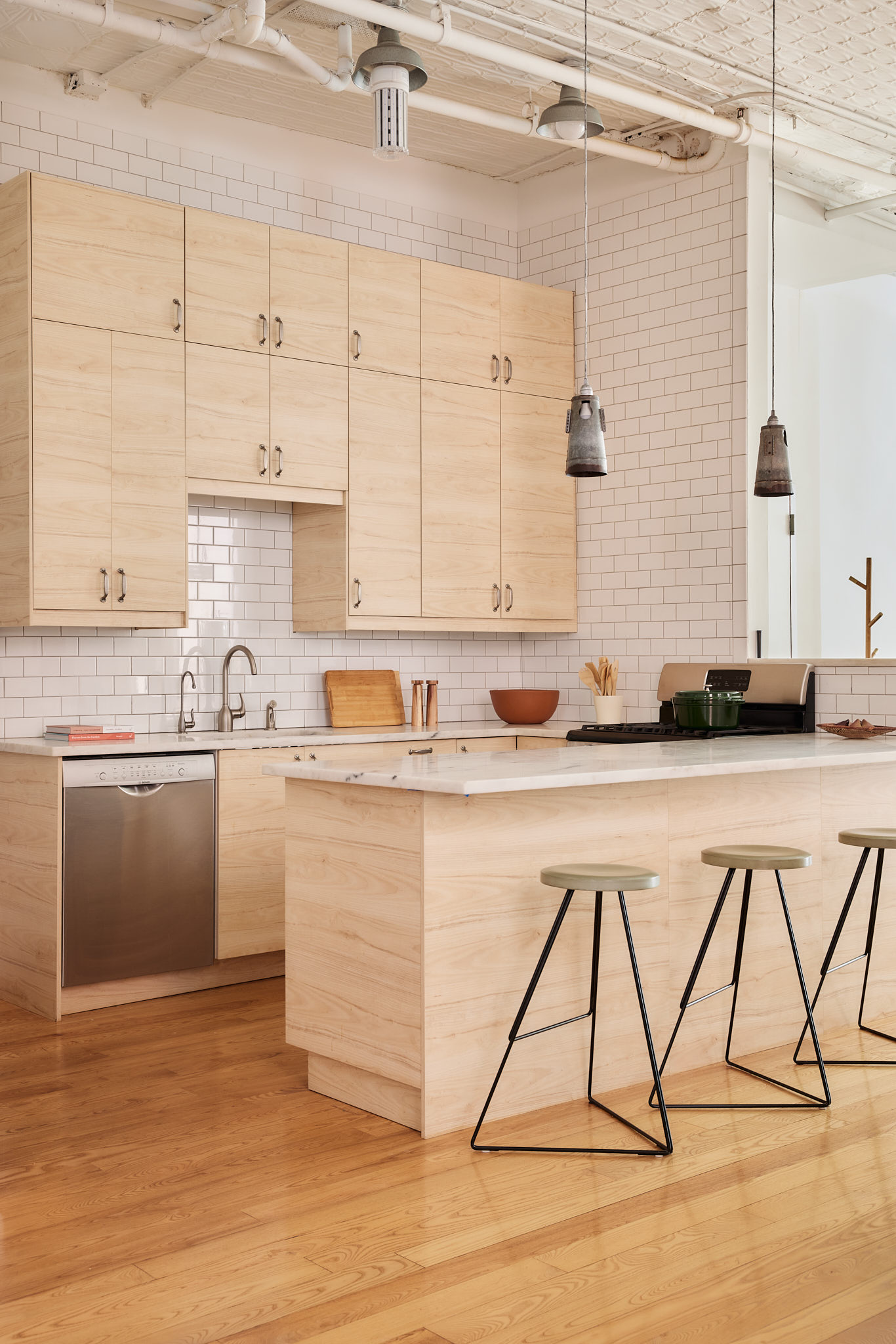 2 Bond Street, Unit 2 Manhattan, NY 10012 - Photo 7 of 16 a kitchen with stainless steel appliances granite countertop a sink a stove and white cabinets