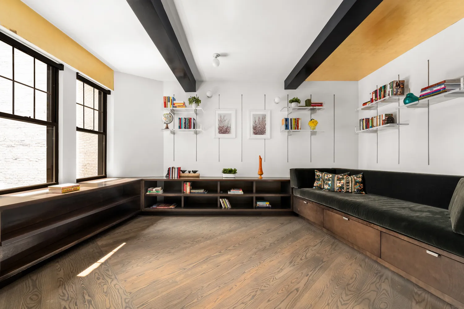 a living room with furniture and large window