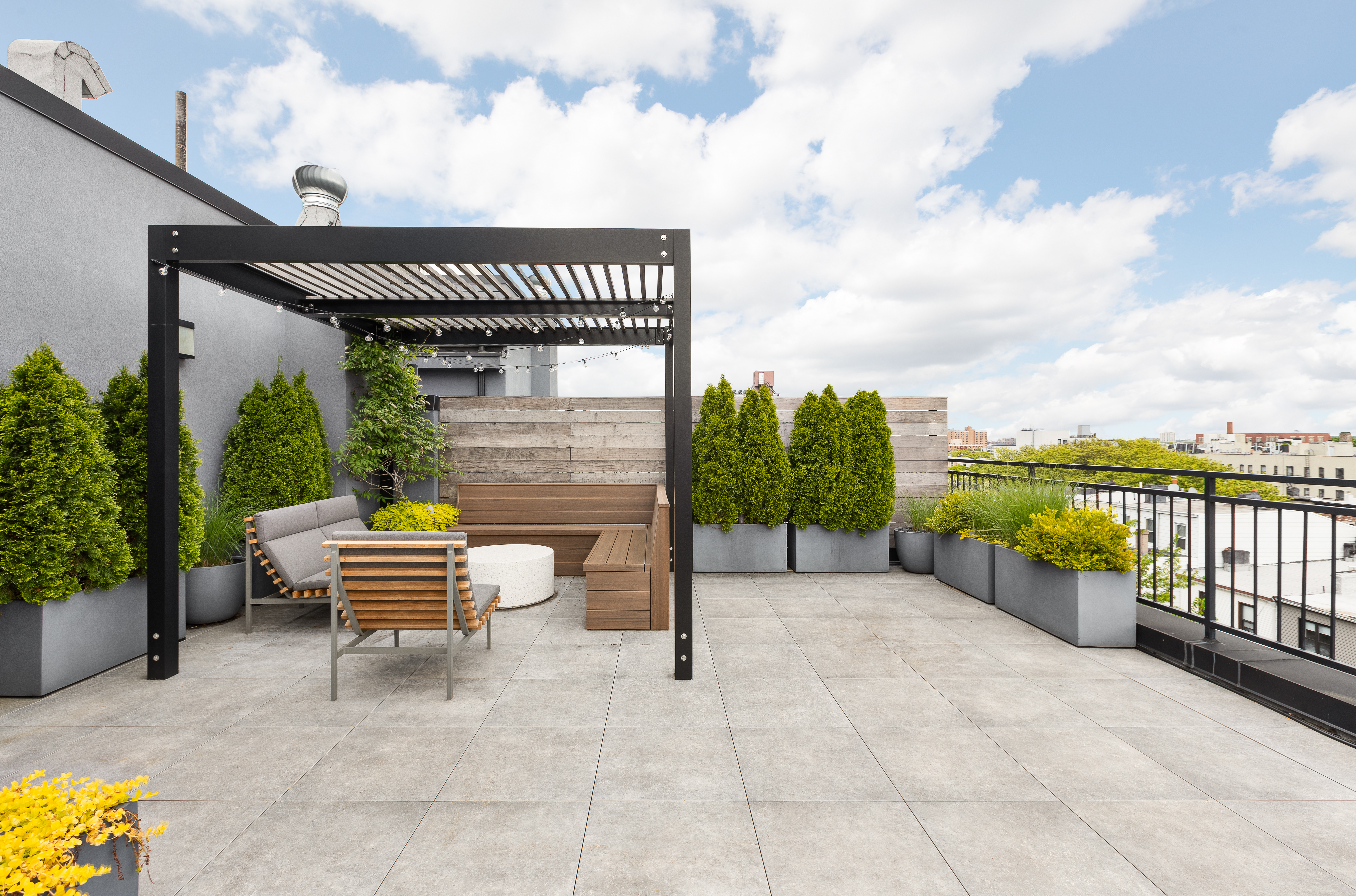 1122 Lafayette Avenue, Unit 4C Brooklyn, NY 11221 - Photo 10 of 14 a balcony with a table and chairs