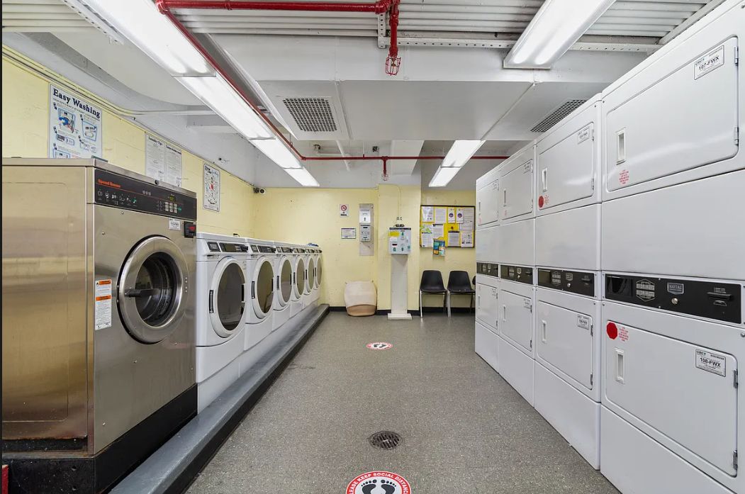 170 West 23rd Street, Unit 2J Manhattan, NY 10011 - Photo 4 of 11 a utility room with dryer and washer