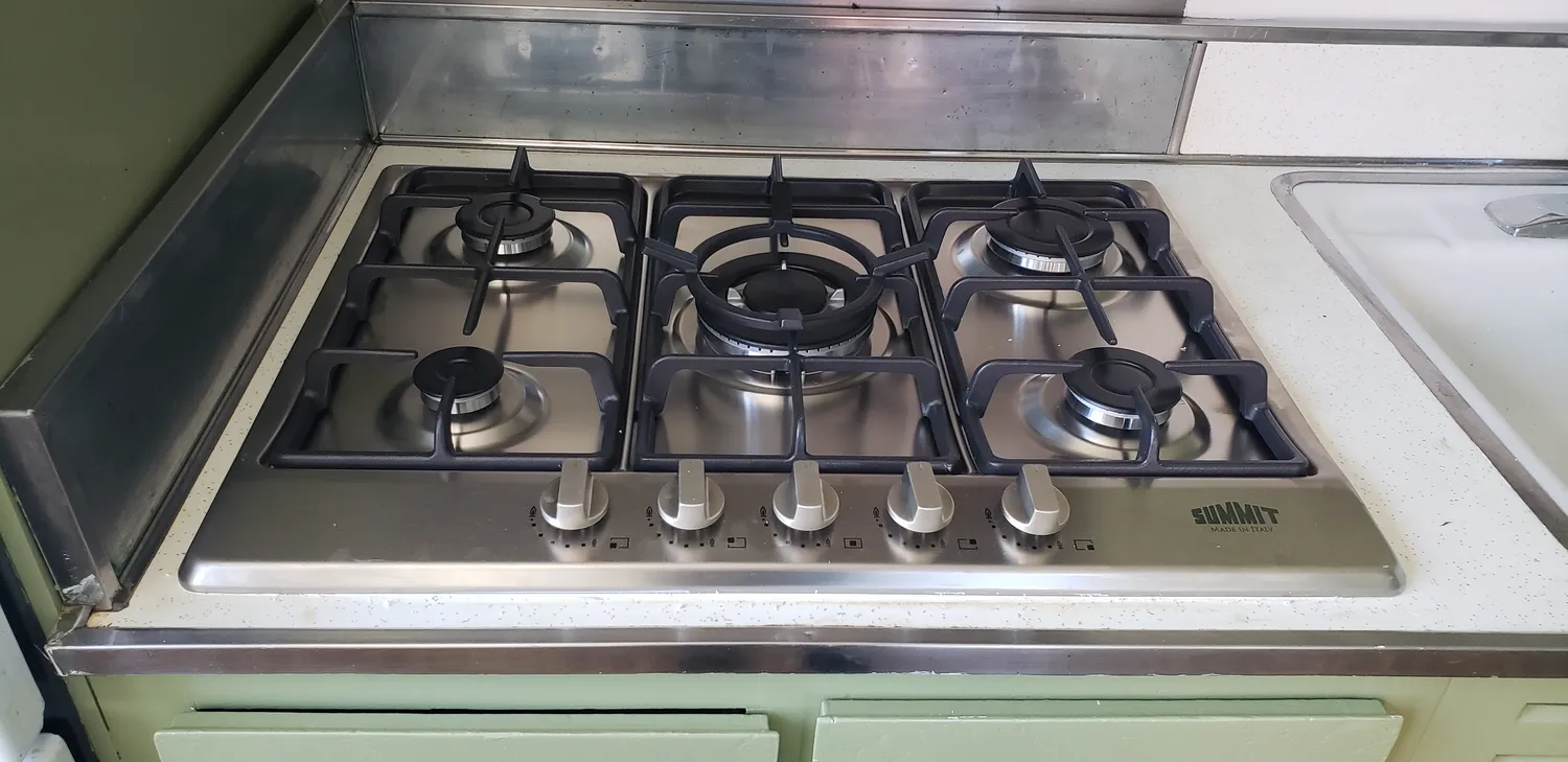 a view of a hallway with entryway windows and chandelier