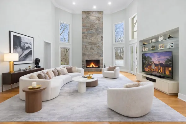 a living room with furniture and a fireplace