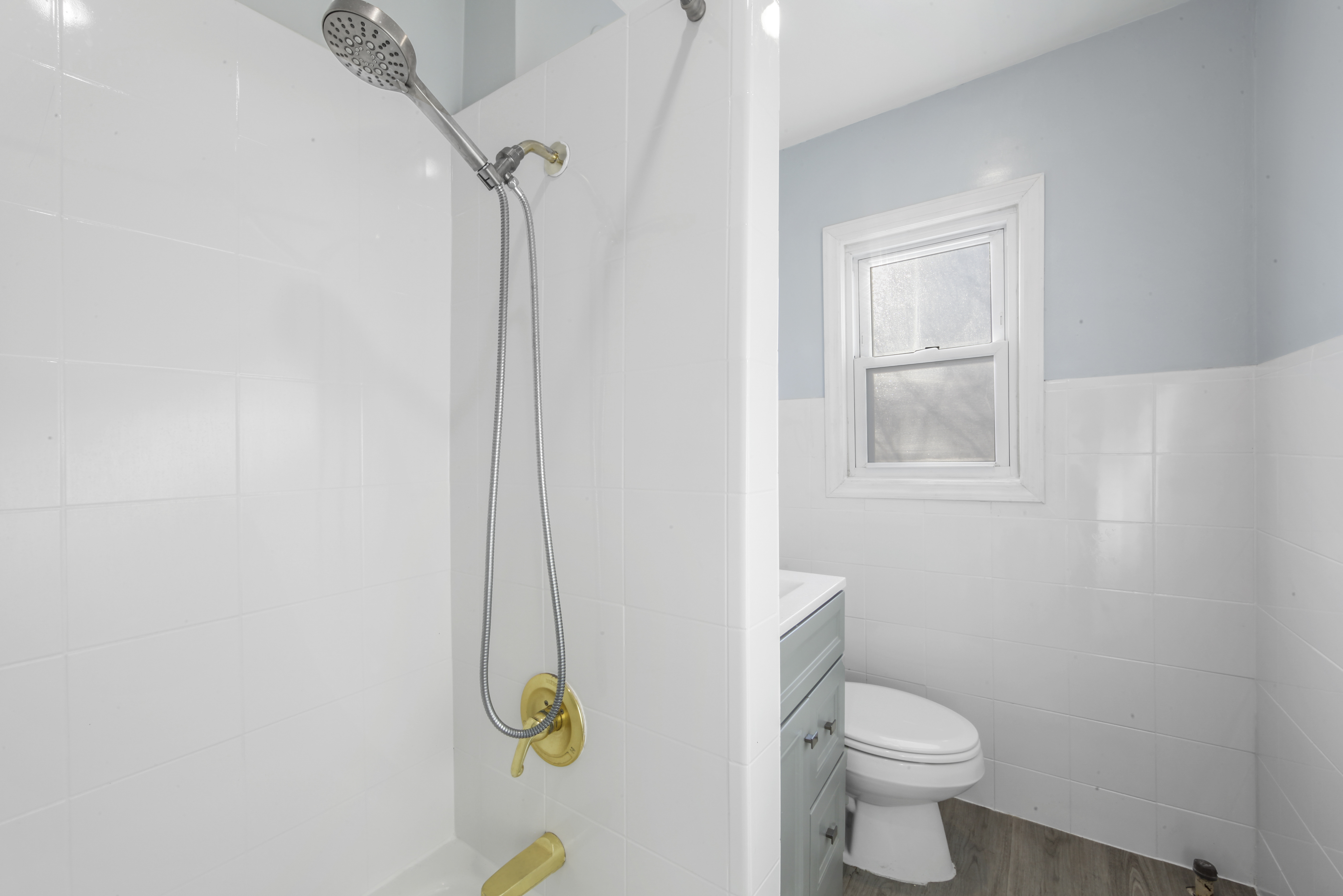 1530 East 51st Street Brooklyn, NY 11234 - Photo 7 of 14 a white toilet sitting next to a bathroom sink