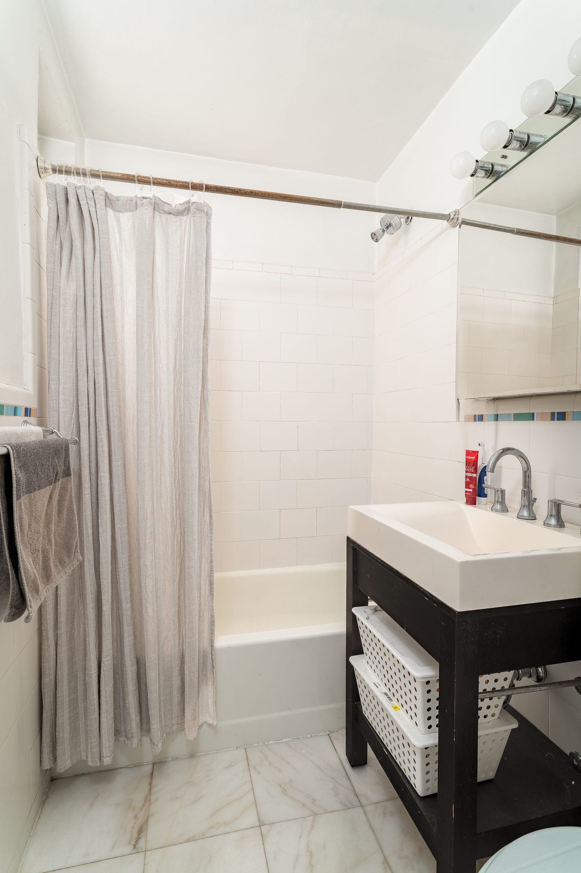 1420 York Avenue, Unit 6J Manhattan, NY 10021 - Photo 10 of 13 a utility room with shower and mirror