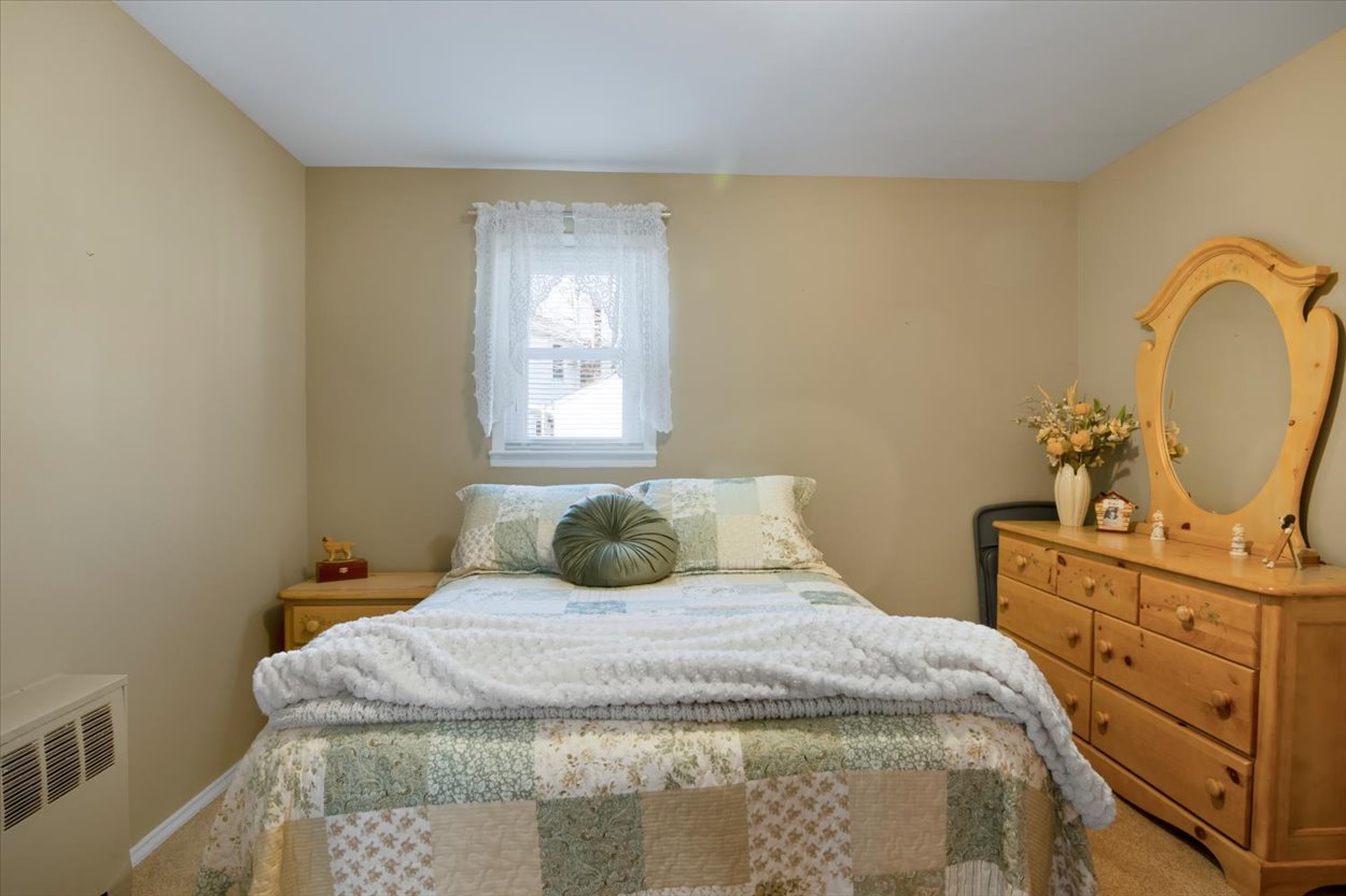 107 Kingston Road Parsippany, NJ 07054 - Photo 16 of 43 a bedroom with a bed and cabinets