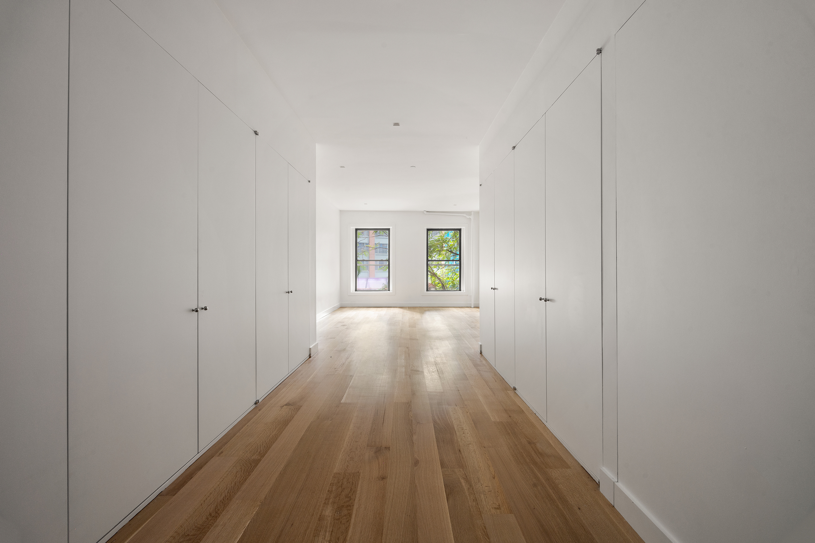 243 West Broadway, Unit 4 Manhattan, NY 10013 - Photo 7 of 14 a view of a hallway with wooden floor