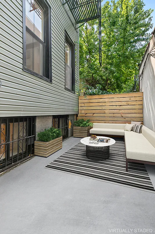 866 Bushwick Avenue, Unit 1 Brooklyn, NY 11221 - Photo 1 of 13 a view of a house with backyard and balcony