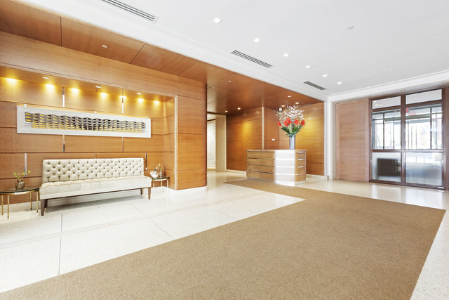 177 9th Avenue, Unit PHA Manhattan, NY 10011 - Photo 23 of 28 a view of a hallway with a couch and chandelier