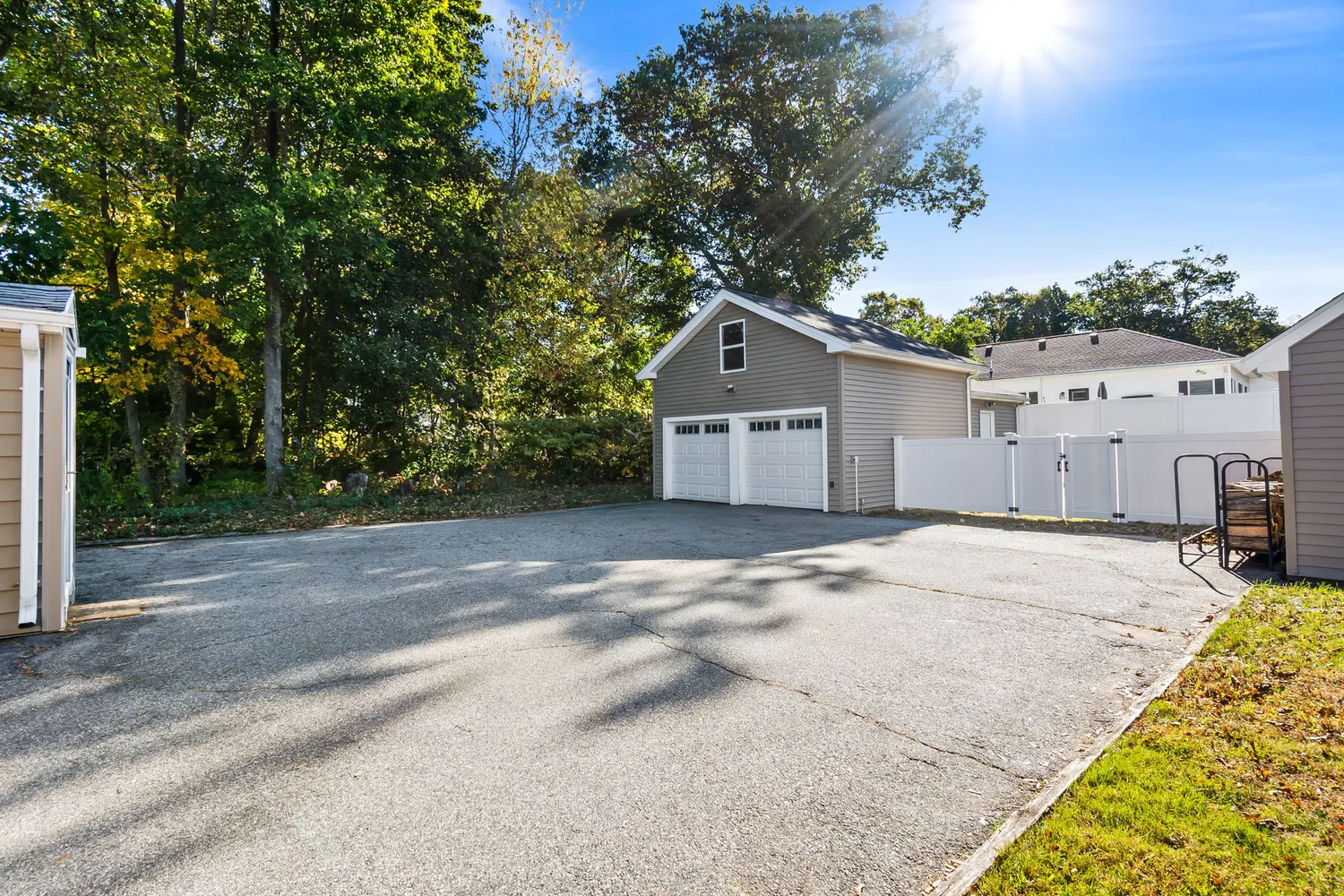 a view of a house with a yard and garage