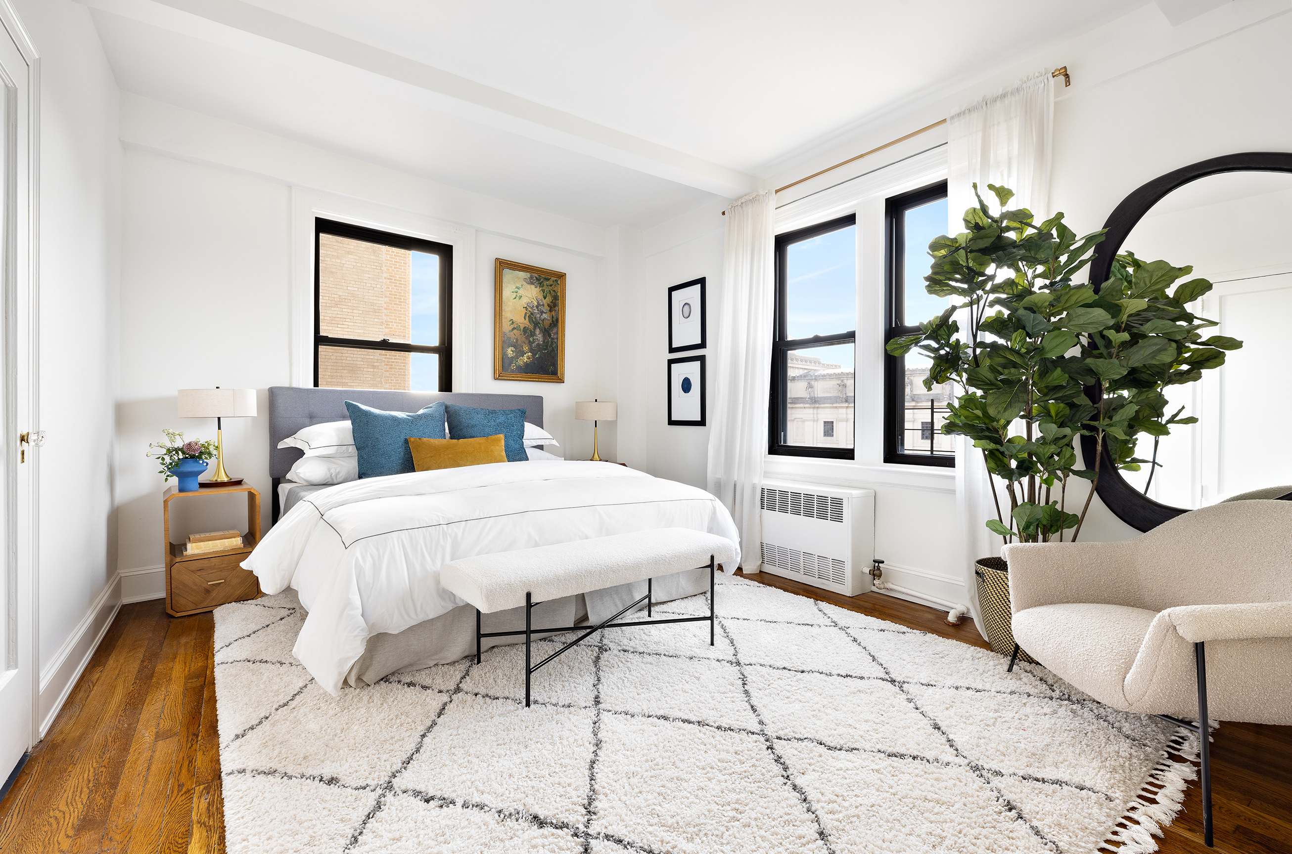 135 Eastern Parkway, Unit 7A Brooklyn, NY 11238 - Photo 11 of 15 a bedroom with a large bed and a potted plant