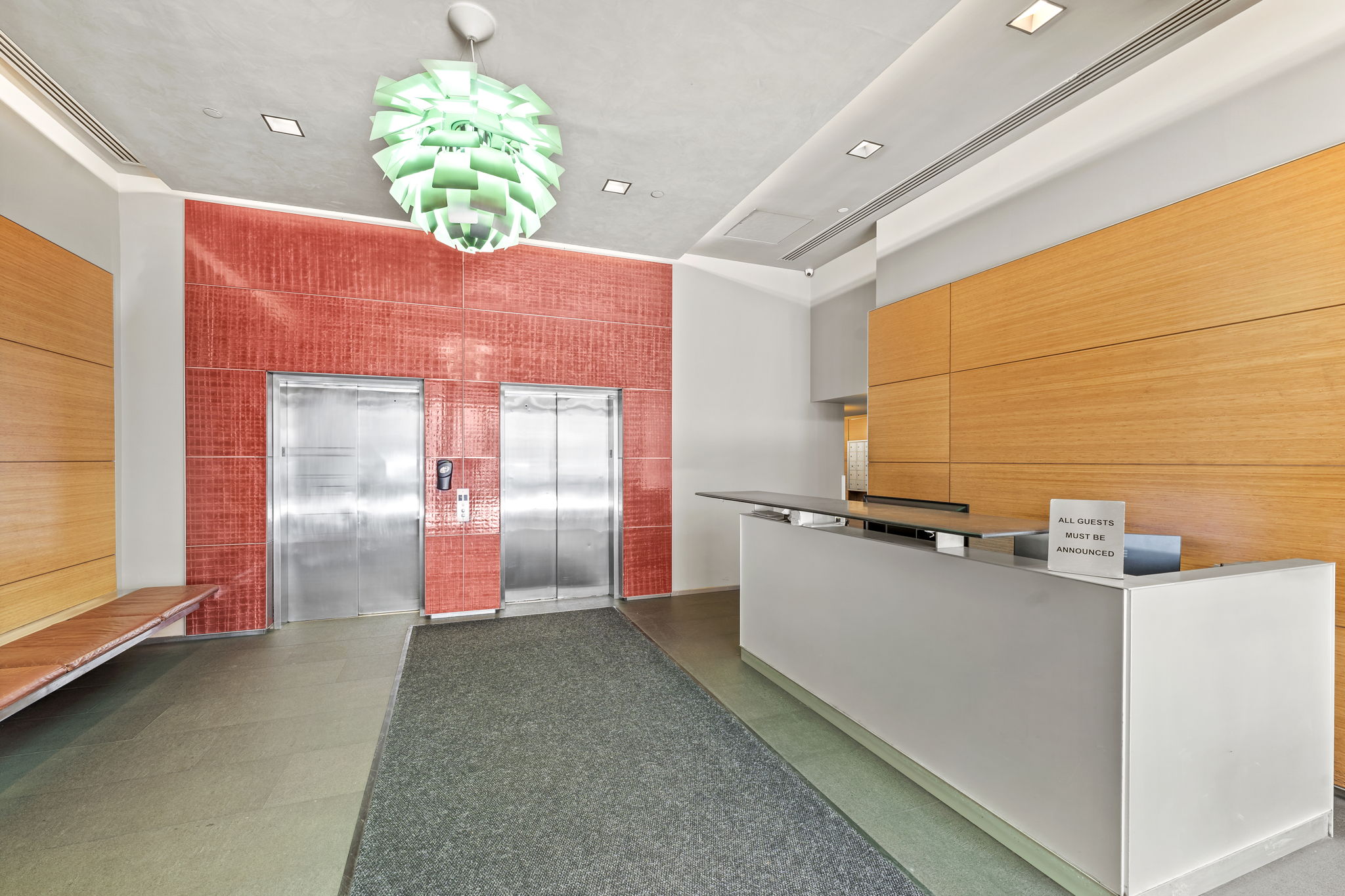 545 West 110th Street, Unit 5A Manhattan, NY 10025 - Photo 12 of 20 a kitchen with kitchen island a counter top space a sink stainless steel appliances and cabinets
