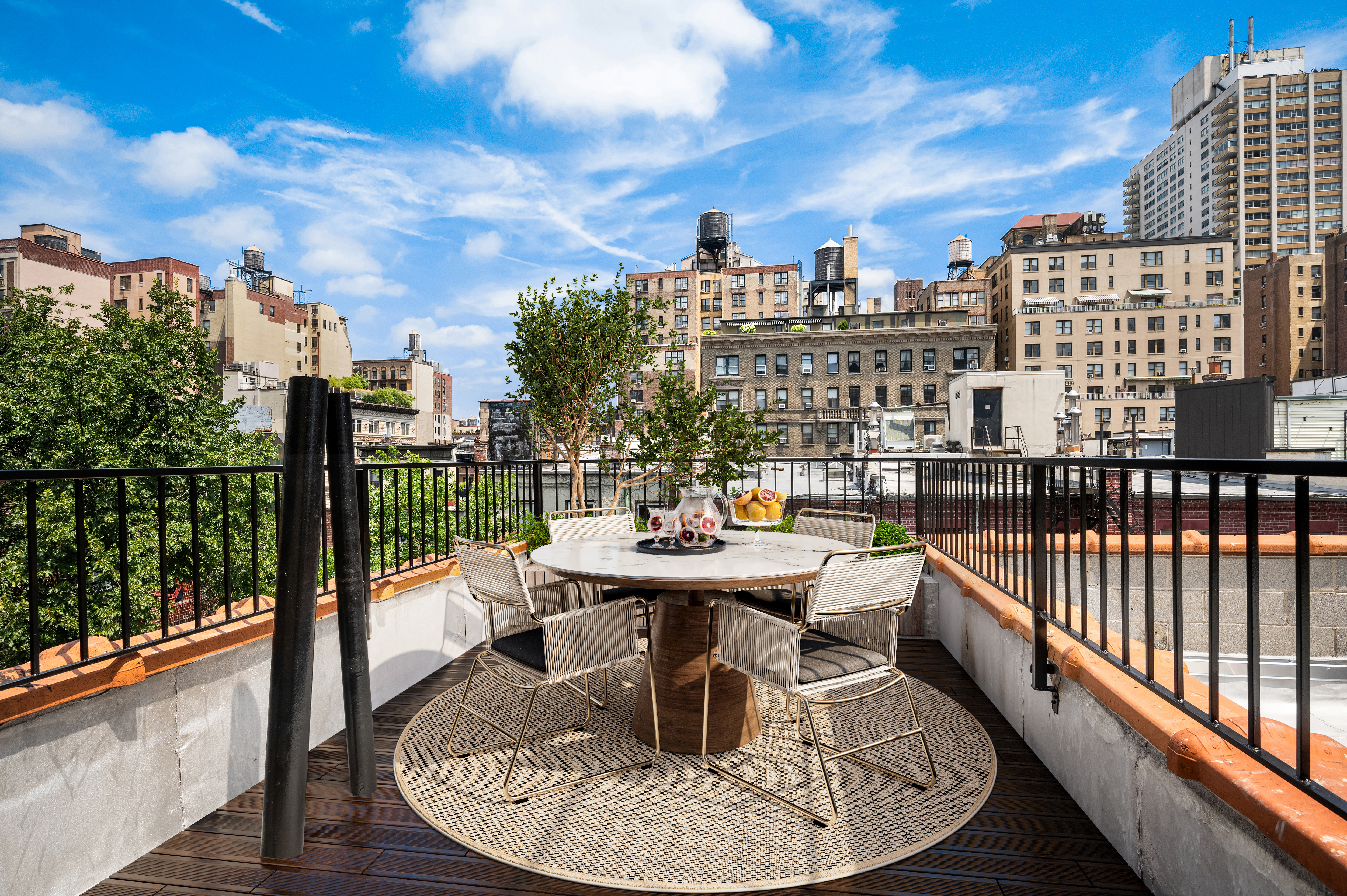 61 West 70th Street, Unit PH Manhattan, NY 10023 - Photo 8 of 18 a terrace with outdoor seating and city view