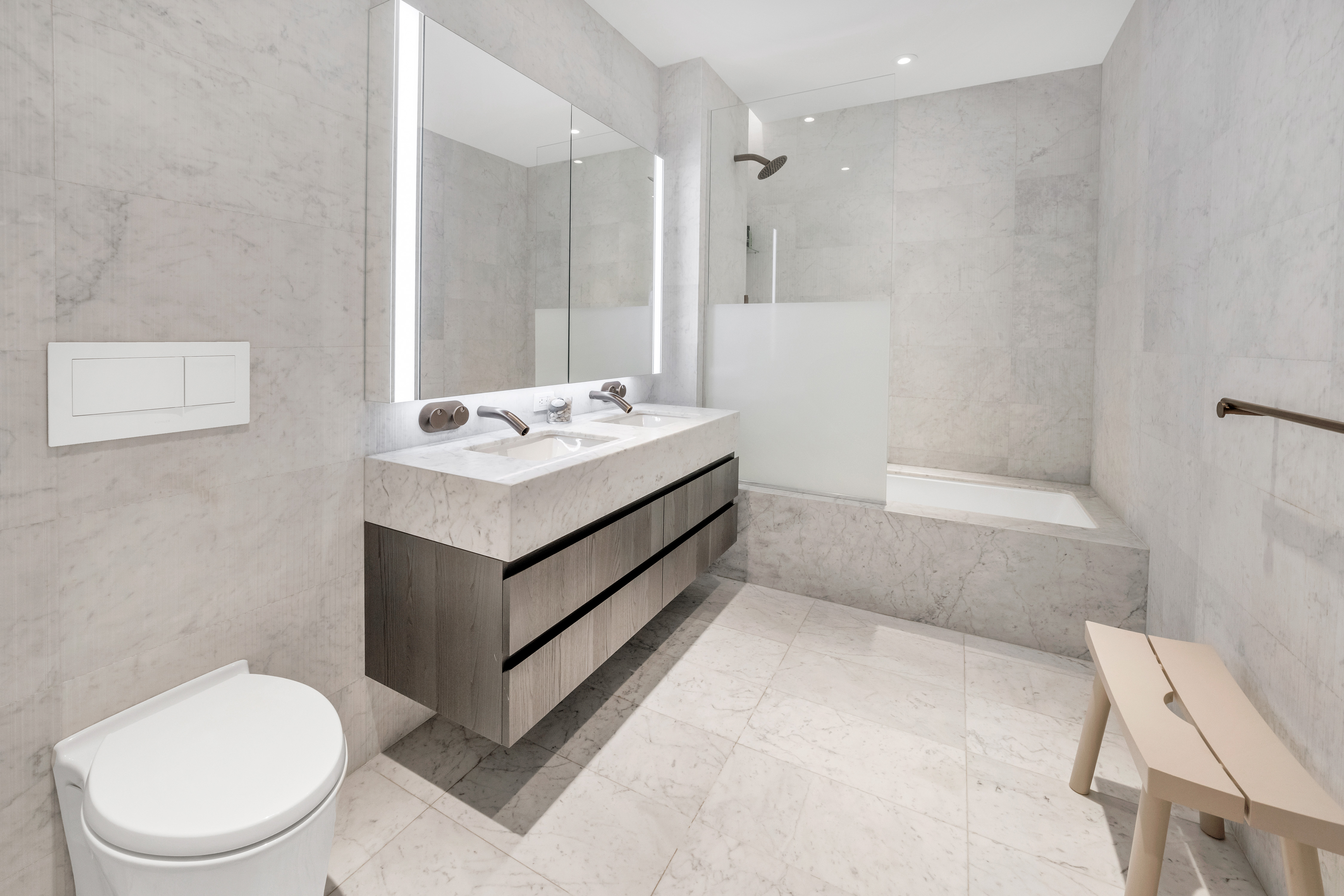 130 William Street, Unit 21A Manhattan, NY 10038 - Photo 7 of 9 a bathroom with a sink toilet and shower