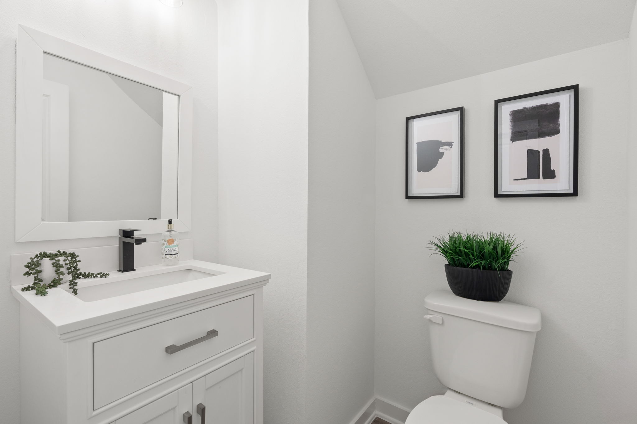 11303 Stonework Grv Lane Houston, TX 77076 - Photo 13 of 39 a bathroom with a toilet sink and mirror
