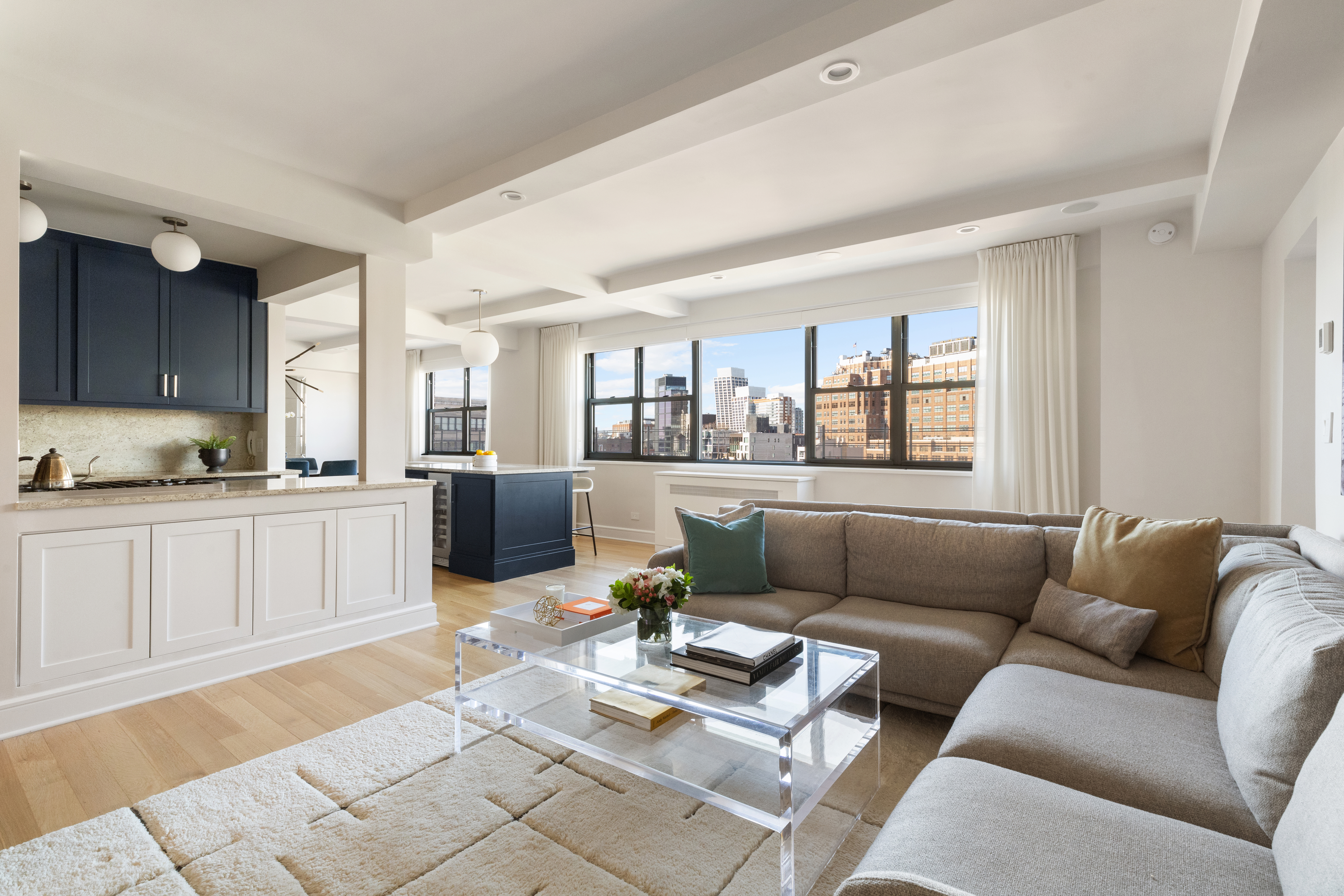 2 Horatio Street, Unit 12RS Manhattan, NY 10014 - Photo 1 of 24 a living room with furniture kitchen and a wooden floor
