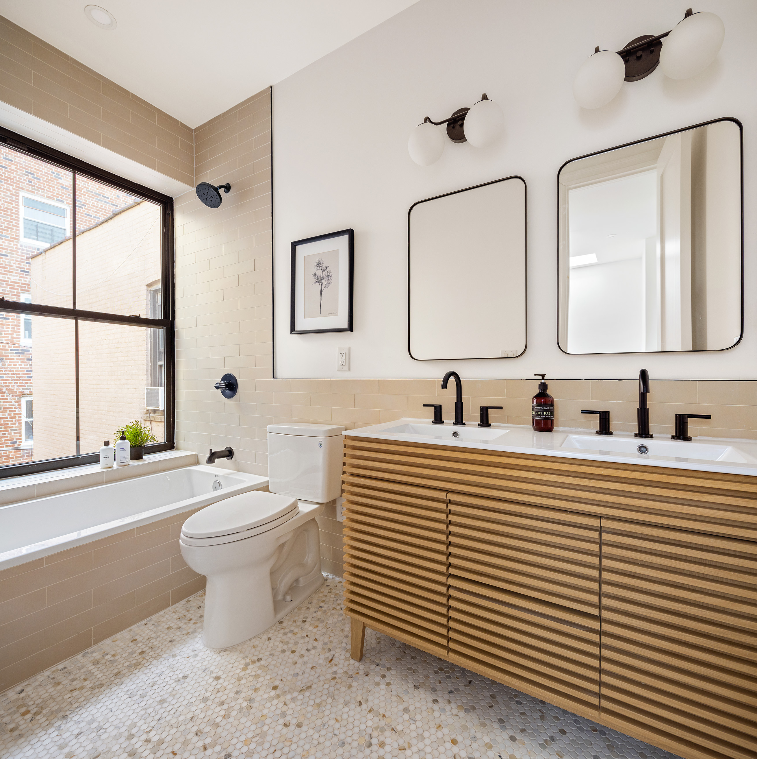 243 East 7th Street Brooklyn, NY 11218 - Photo 14 of 19 a bathroom with a sink and a mirror
