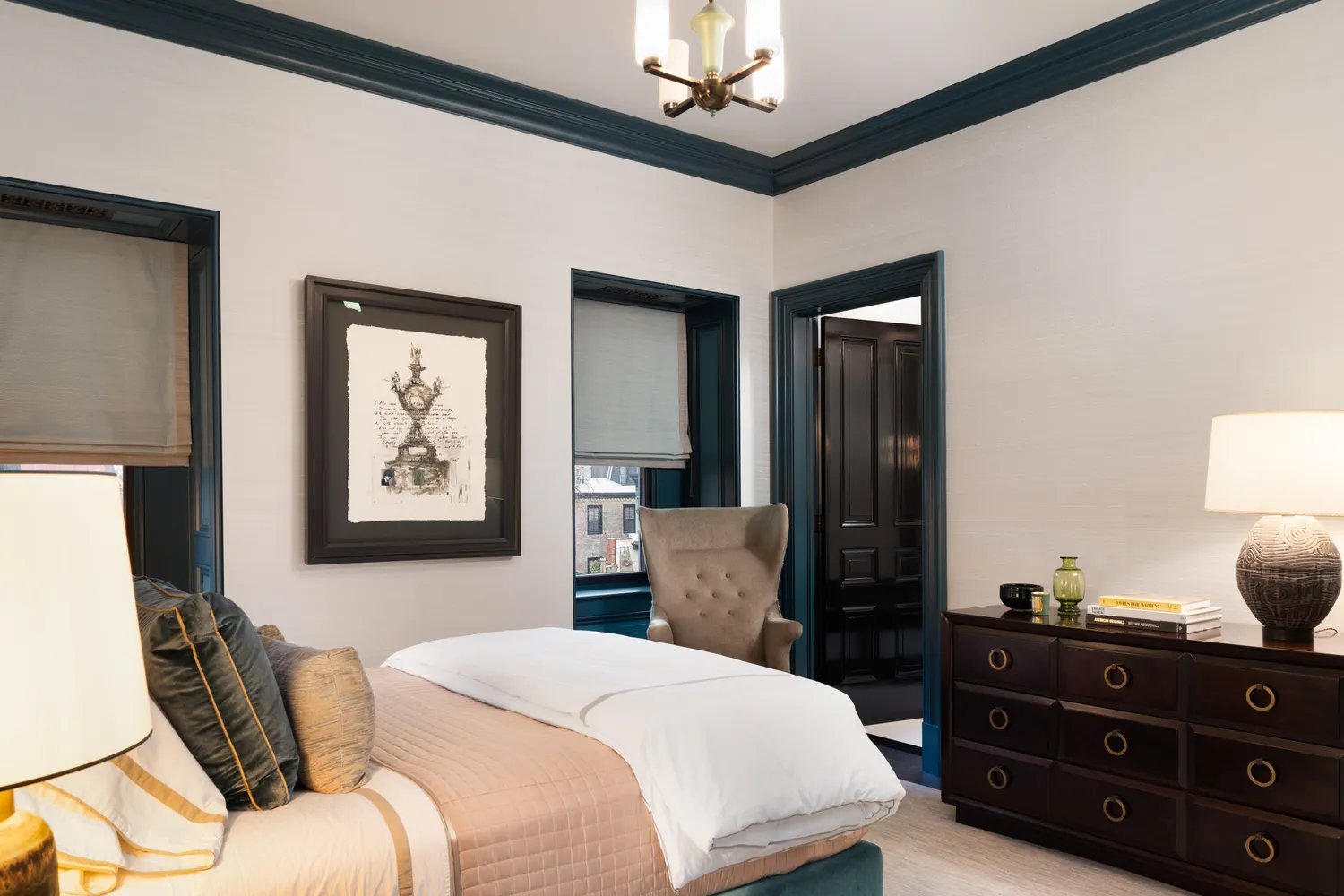 a bedroom with a bed and a dresser in it