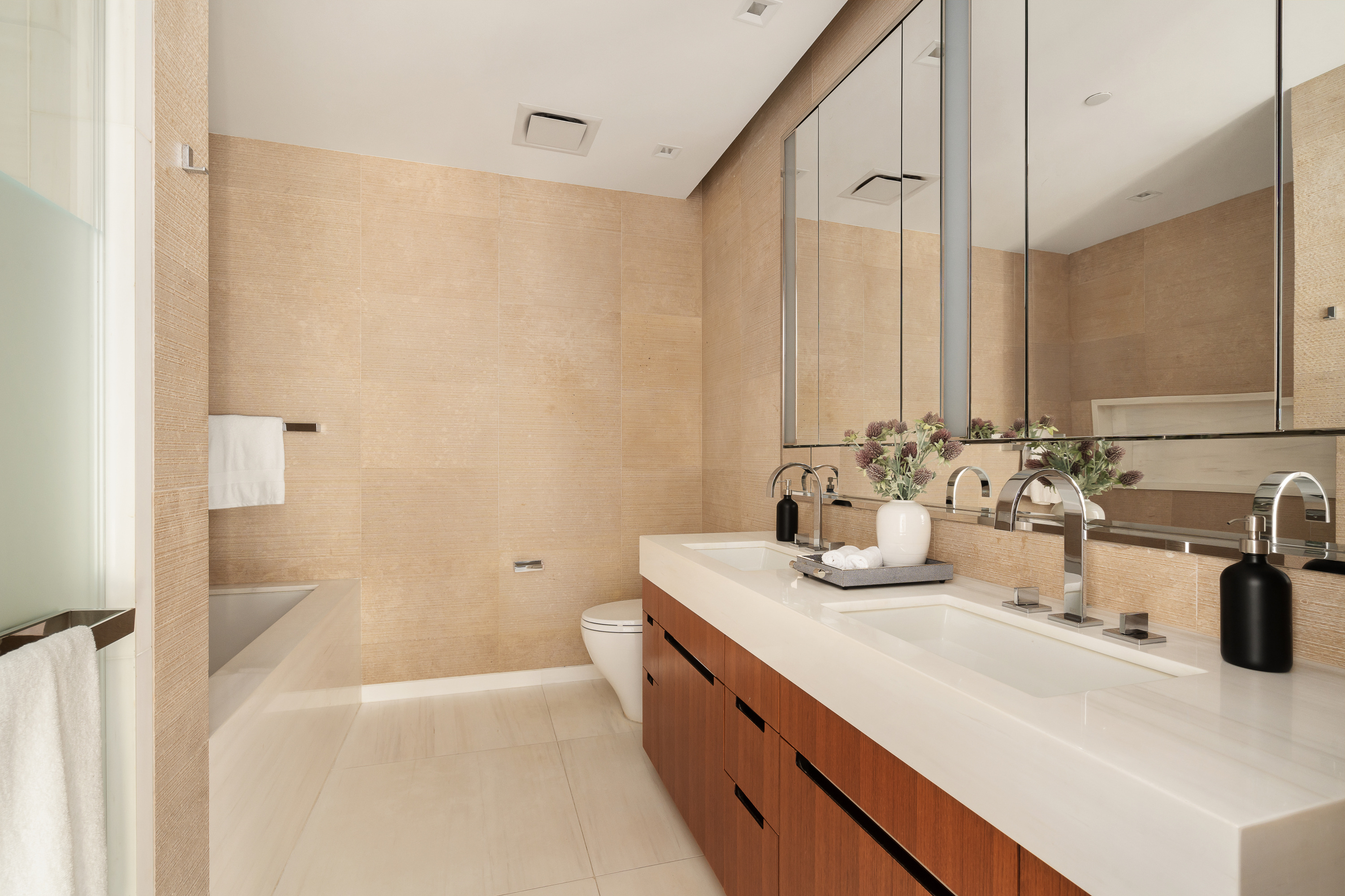 1 West End Avenue, Unit 15J Manhattan, NY 10023 - Photo 6 of 20 a bathroom with a double vanity sink mirror and double